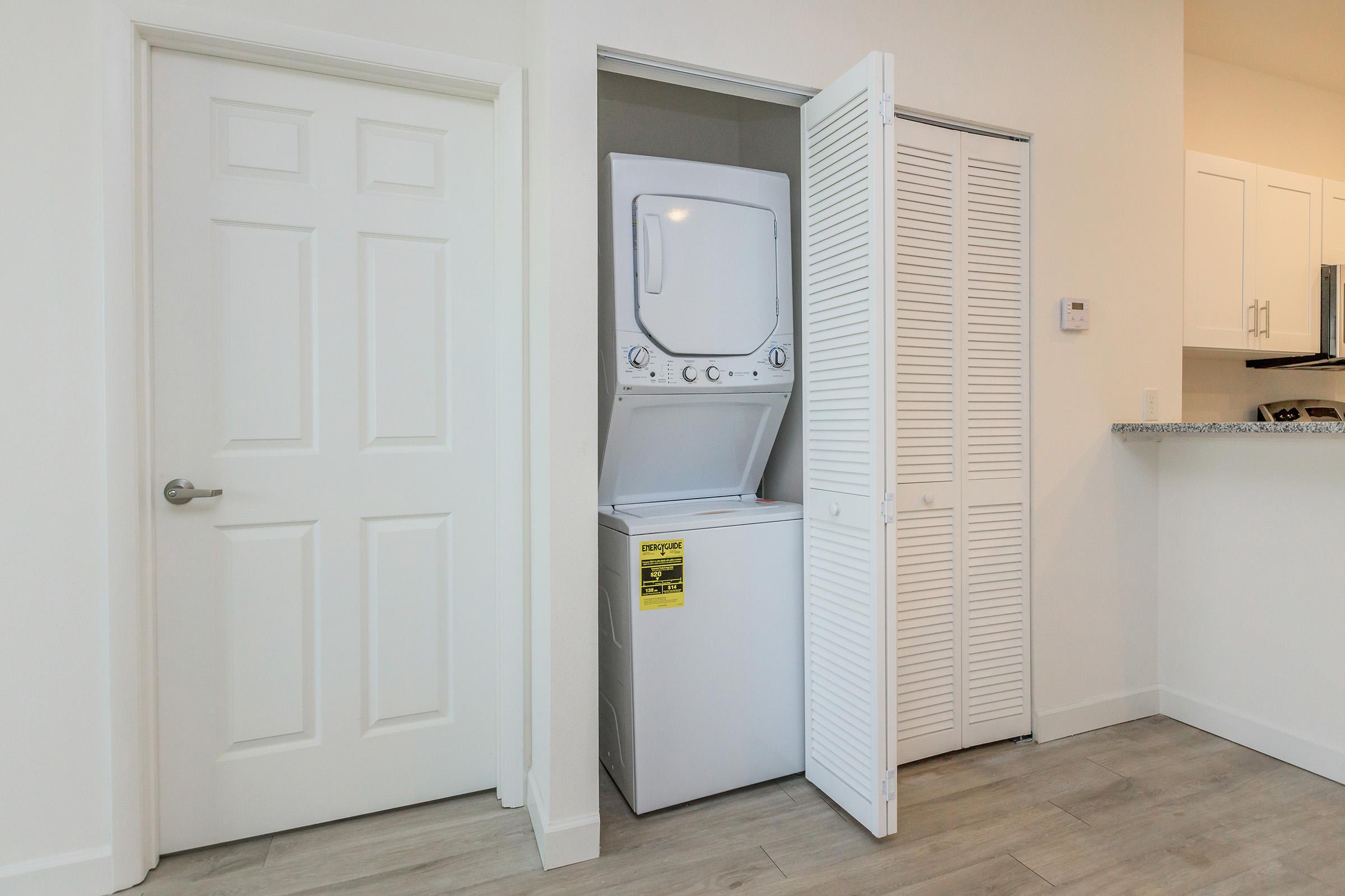 a kitchen with a sink and a refrigerator