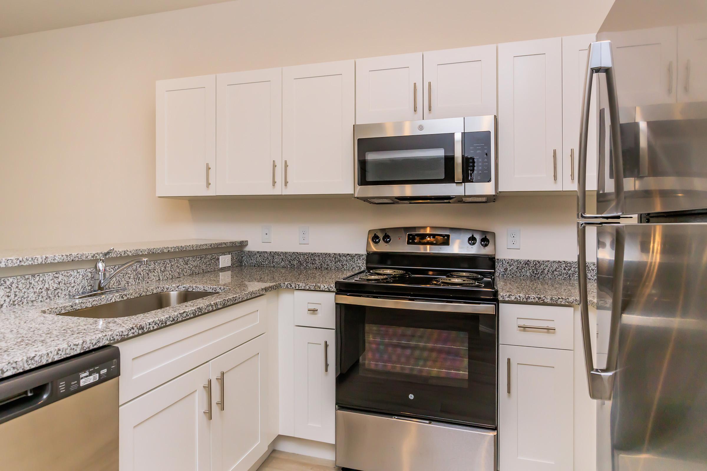 a kitchen with a stove top oven sitting inside of a refrigerator