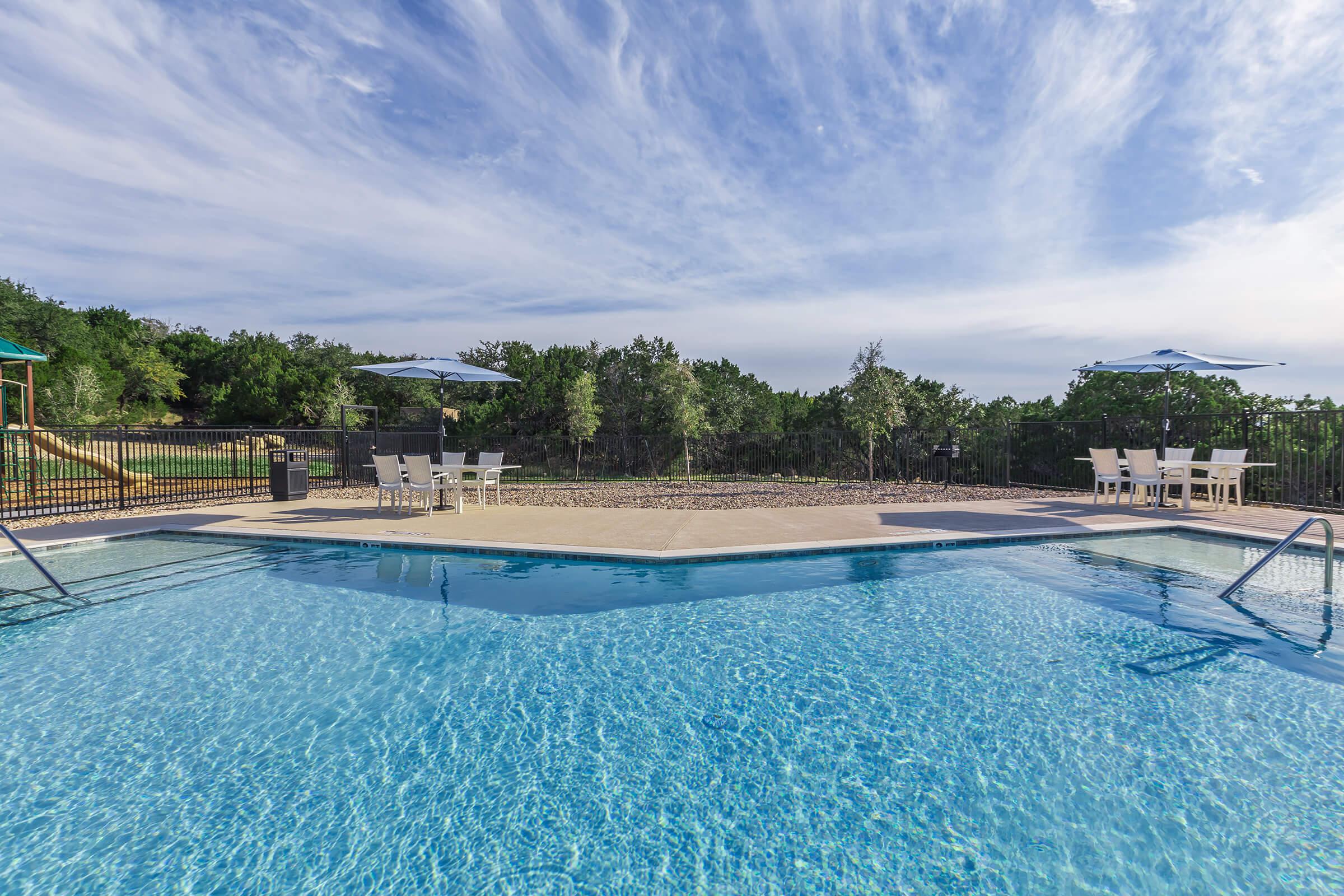 a pool next to a body of water