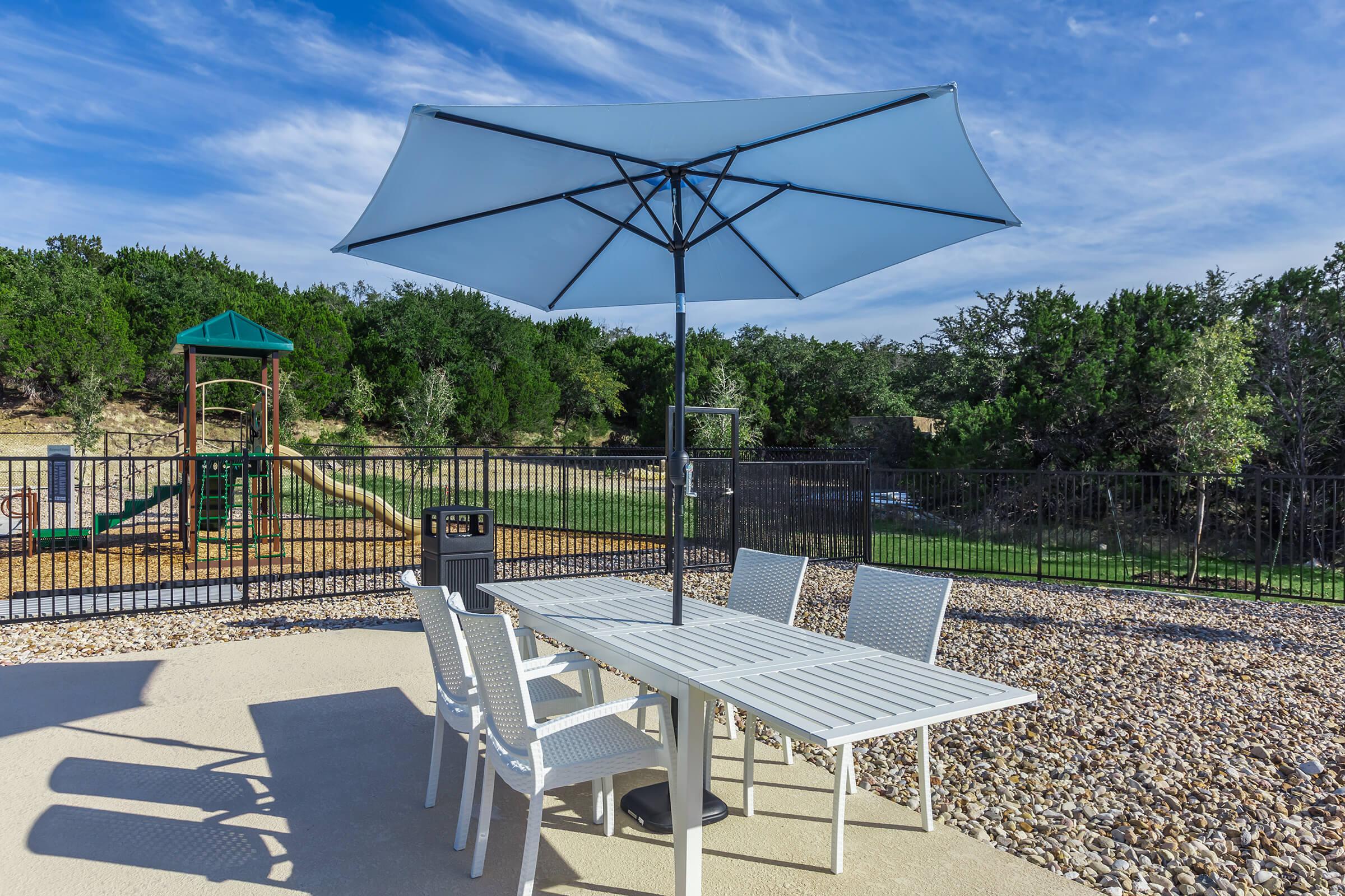 a lawn chair under an umbrella