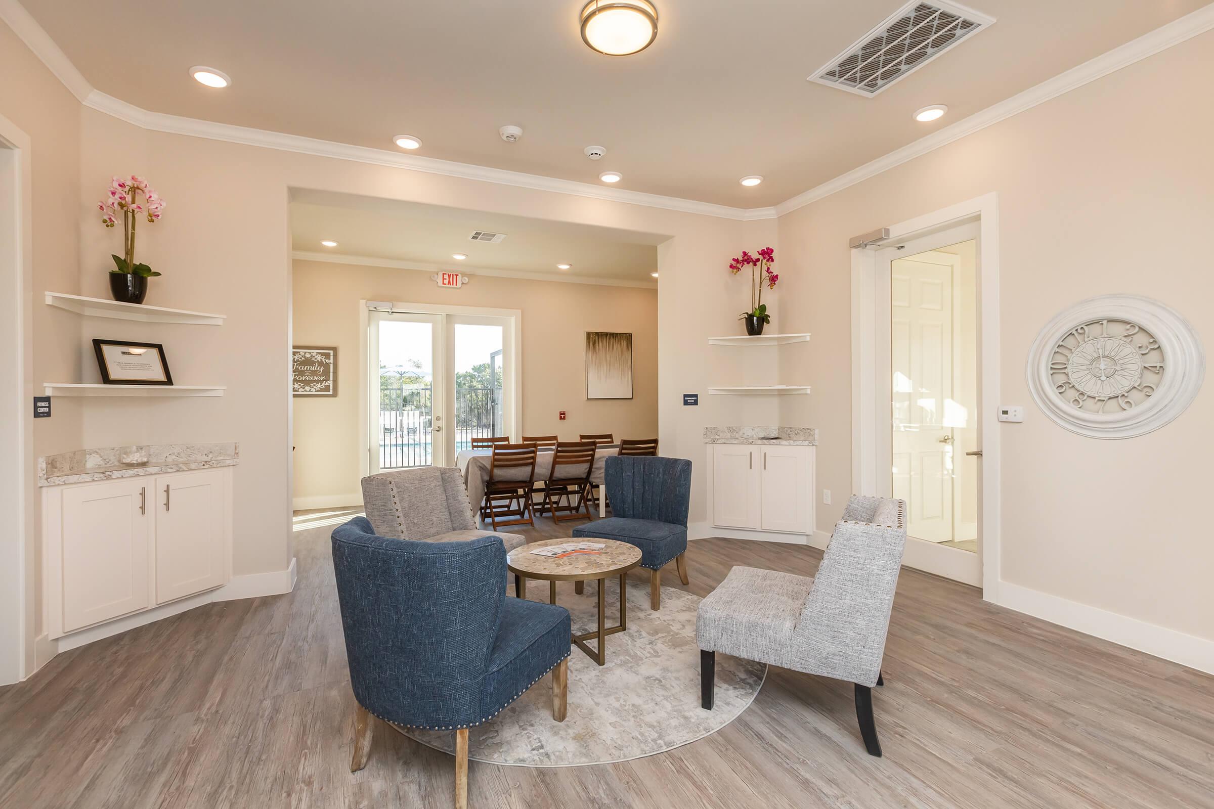 a living room filled with furniture and a rug