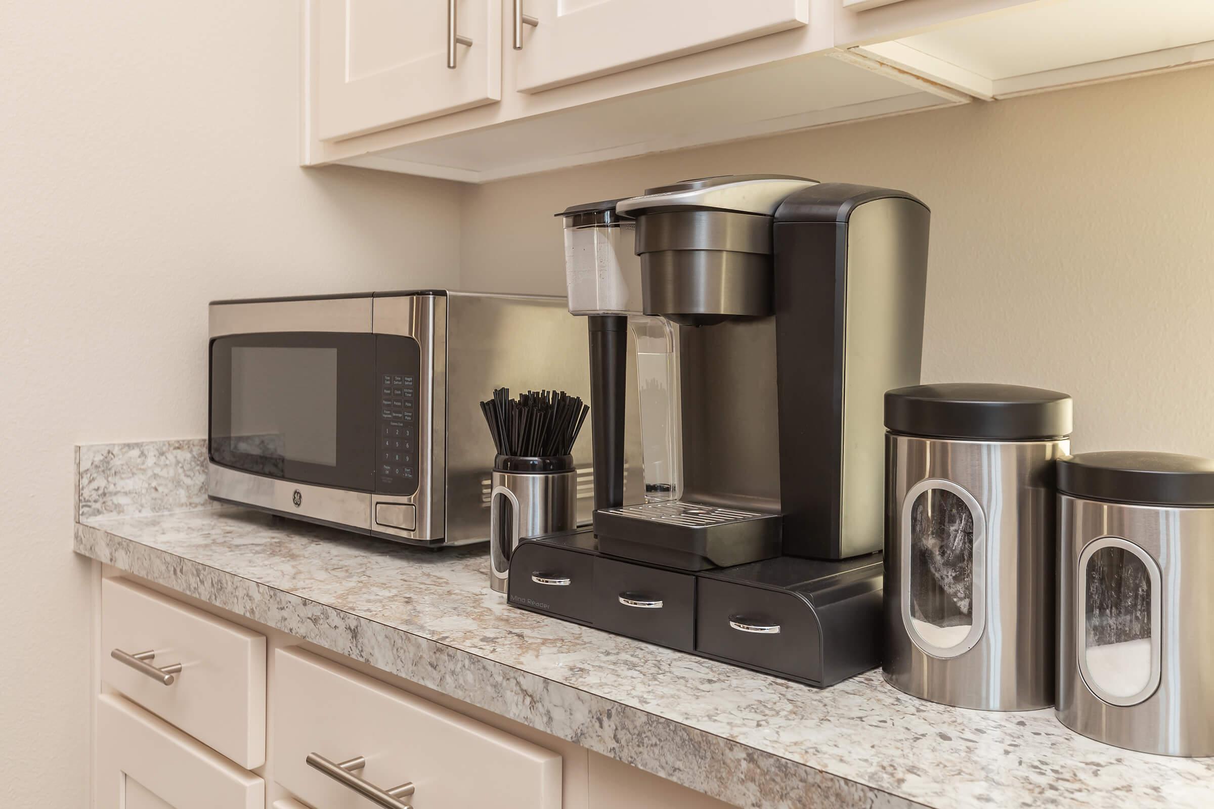 a microwave is sitting on a kitchen counter