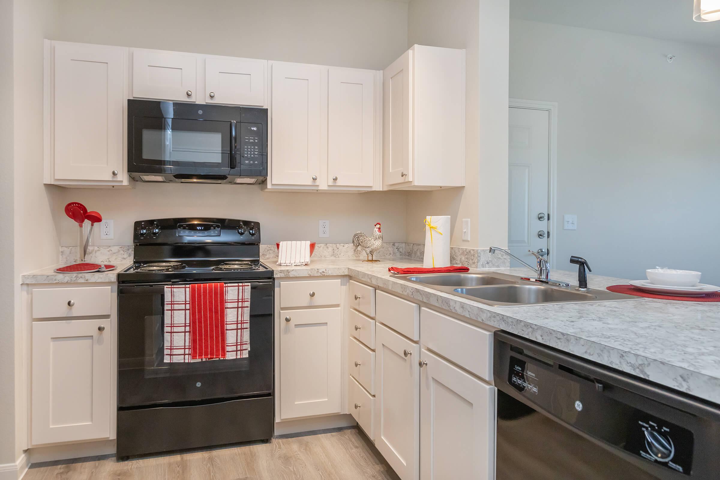 a kitchen with a stove and a refrigerator