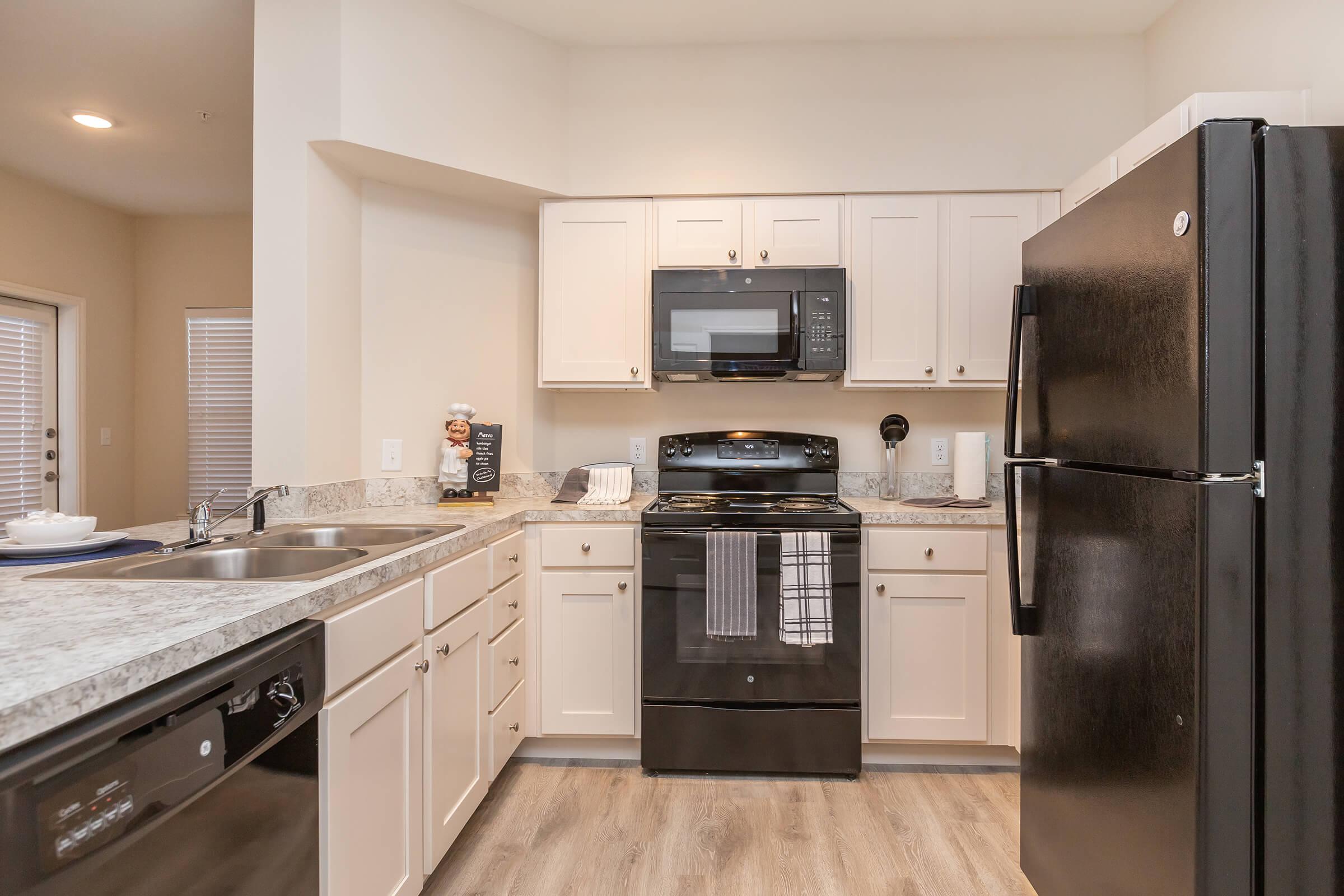 a large kitchen with stainless steel appliances