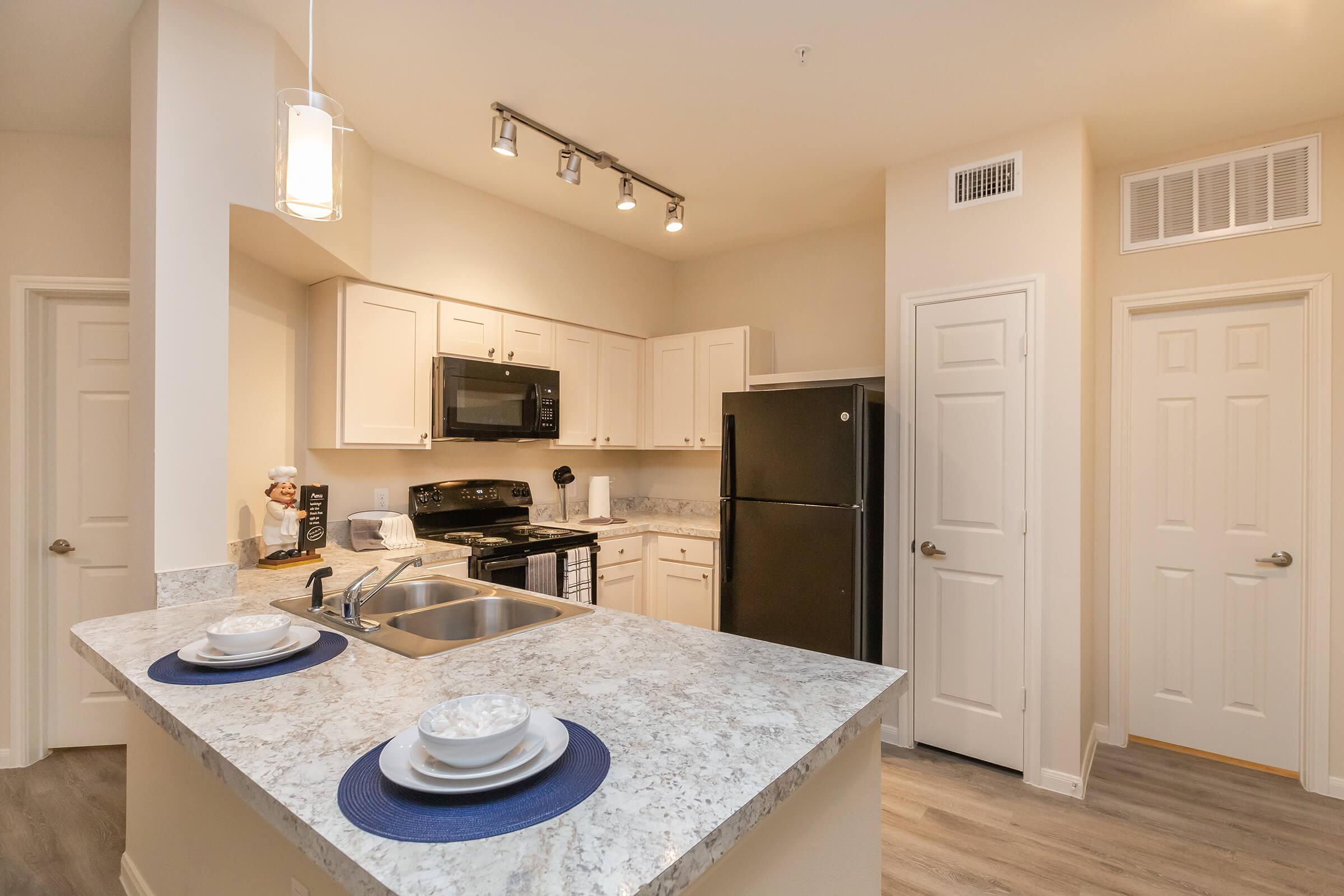 a kitchen with a stove and a sink