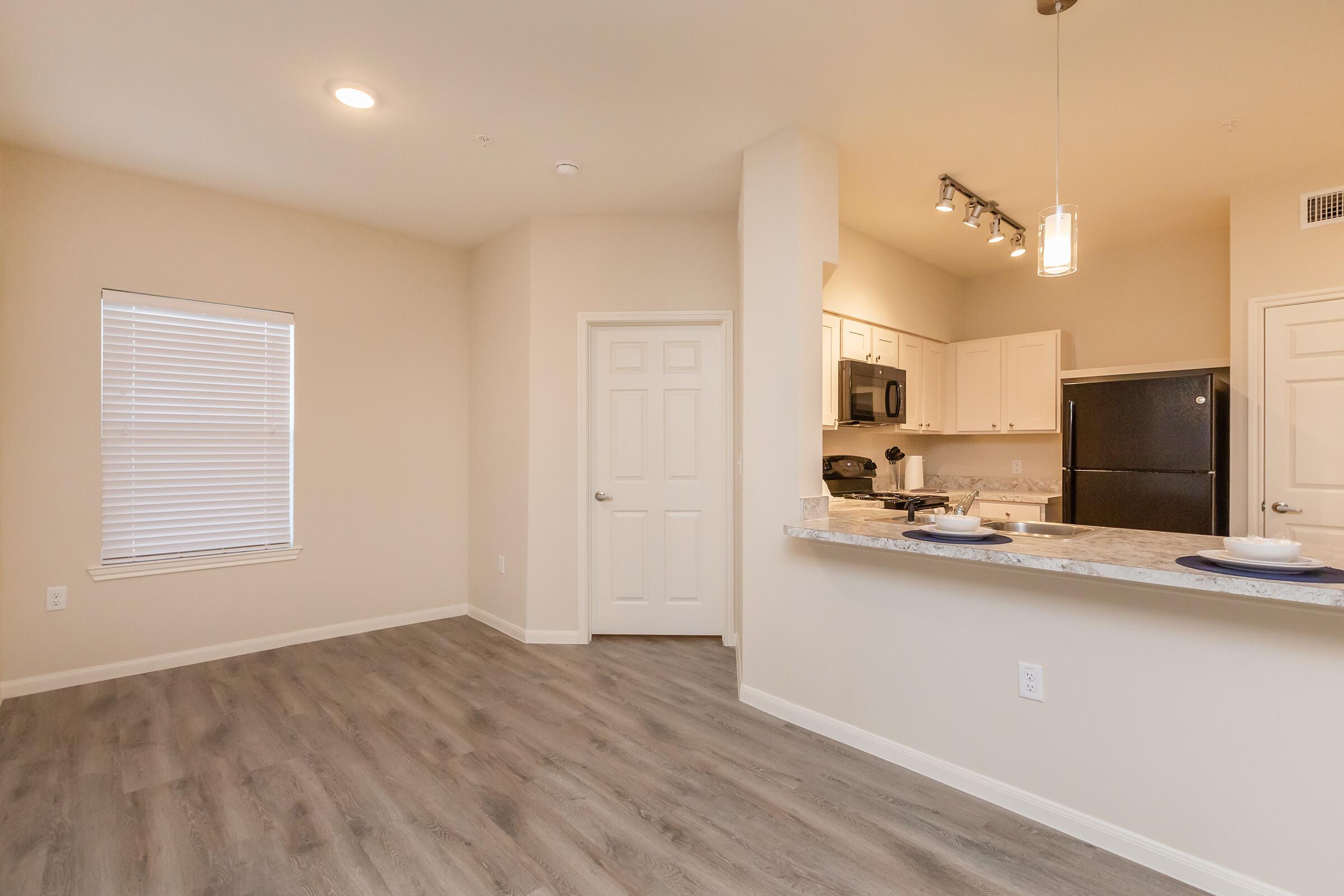 a kitchen with a wood floor