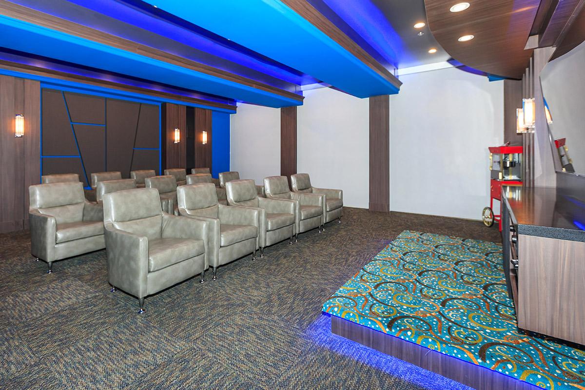 a room filled with furniture and a blue suitcase