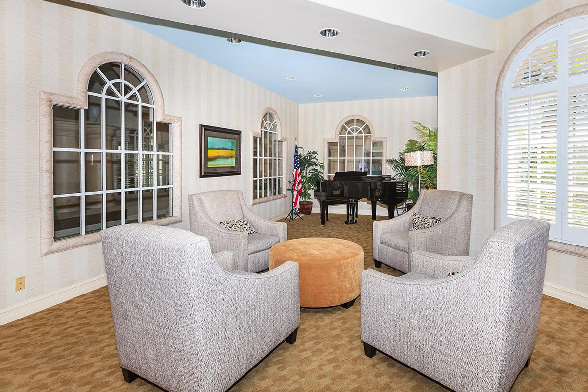 a living room filled with furniture and a large window