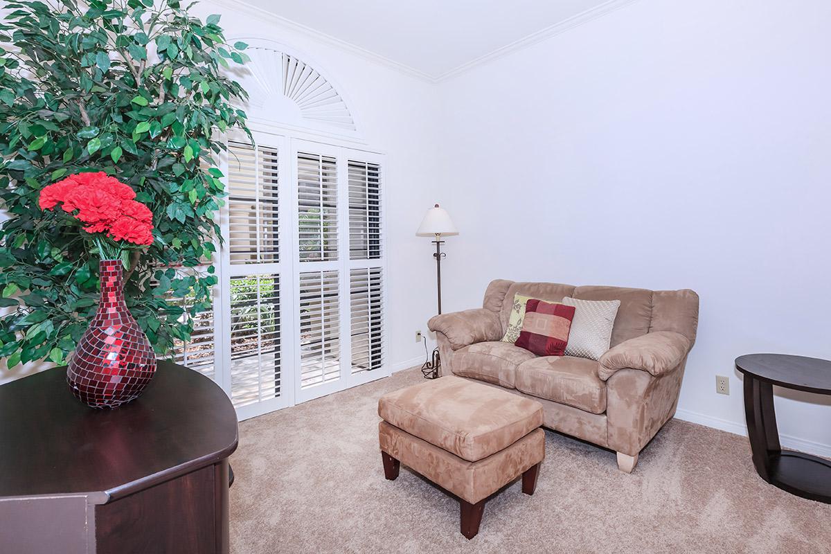 a living room with a leather chair