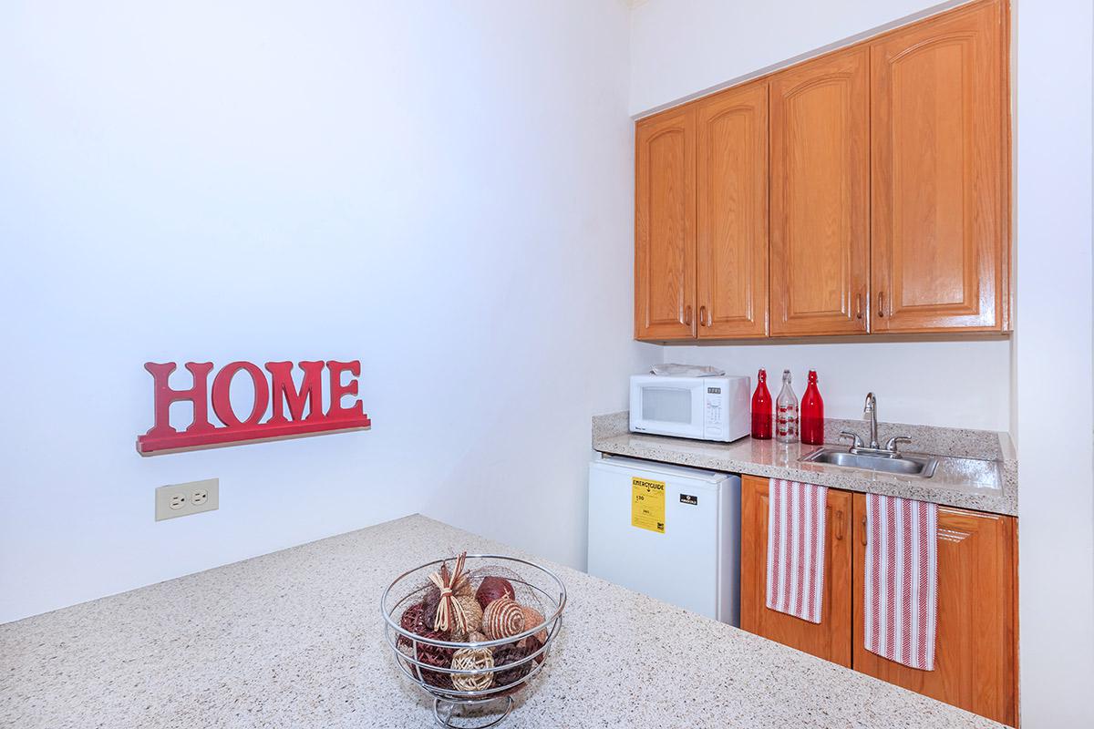 a kitchen with a sink and a refrigerator