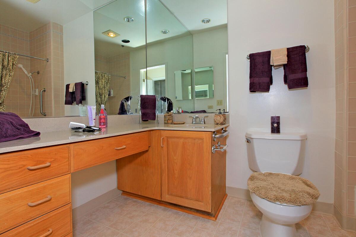 a kitchen with a sink and a mirror