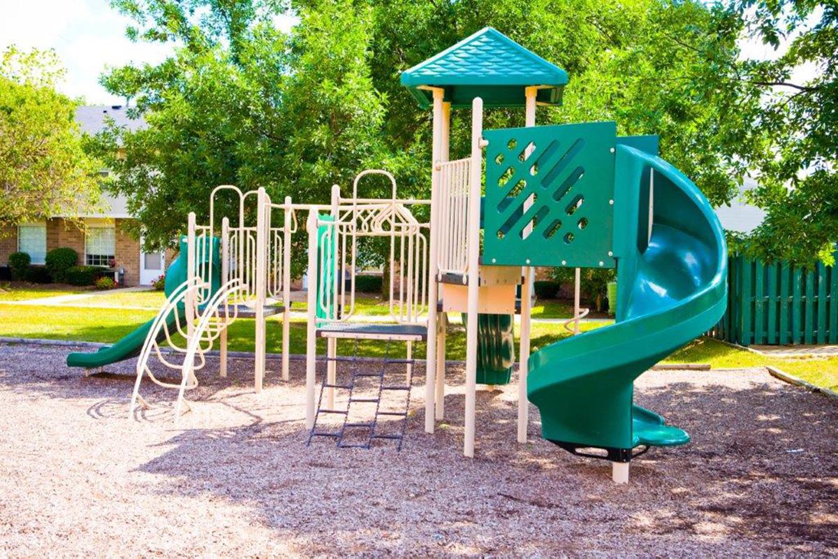 a chair sitting in front of a playground