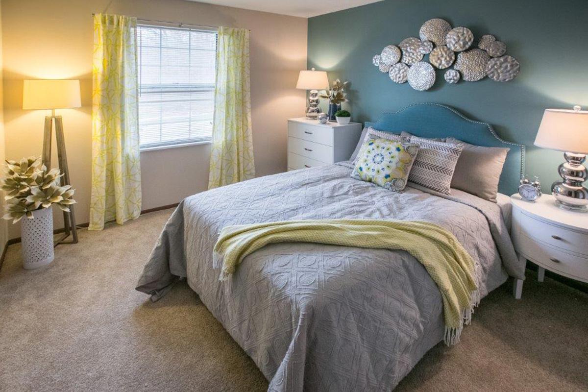 a bedroom with a bed in a hotel room