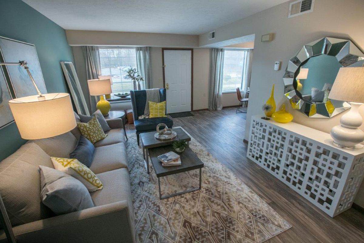 a living room filled with furniture and a fire place