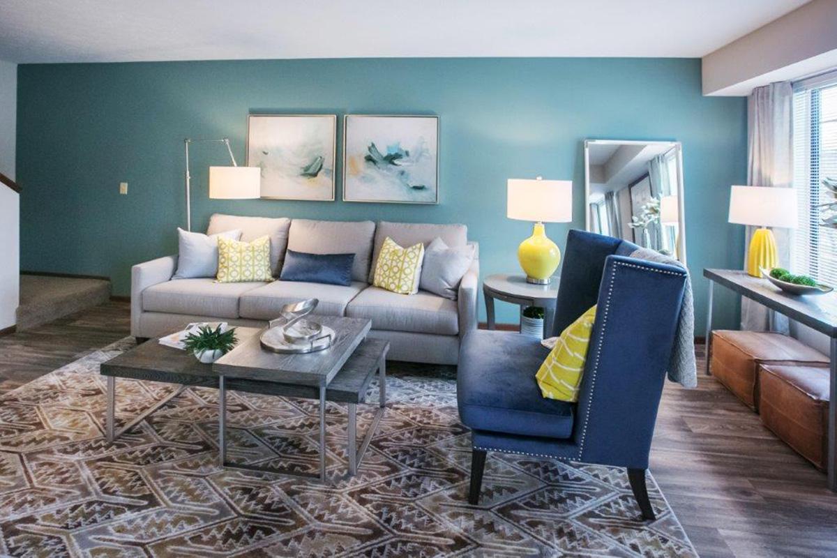 a living room filled with furniture and a fireplace