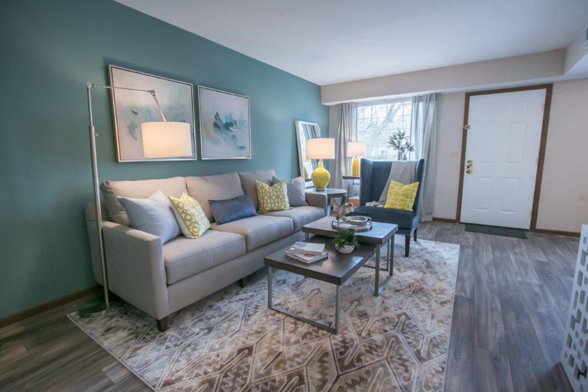 a living room filled with furniture and a fireplace