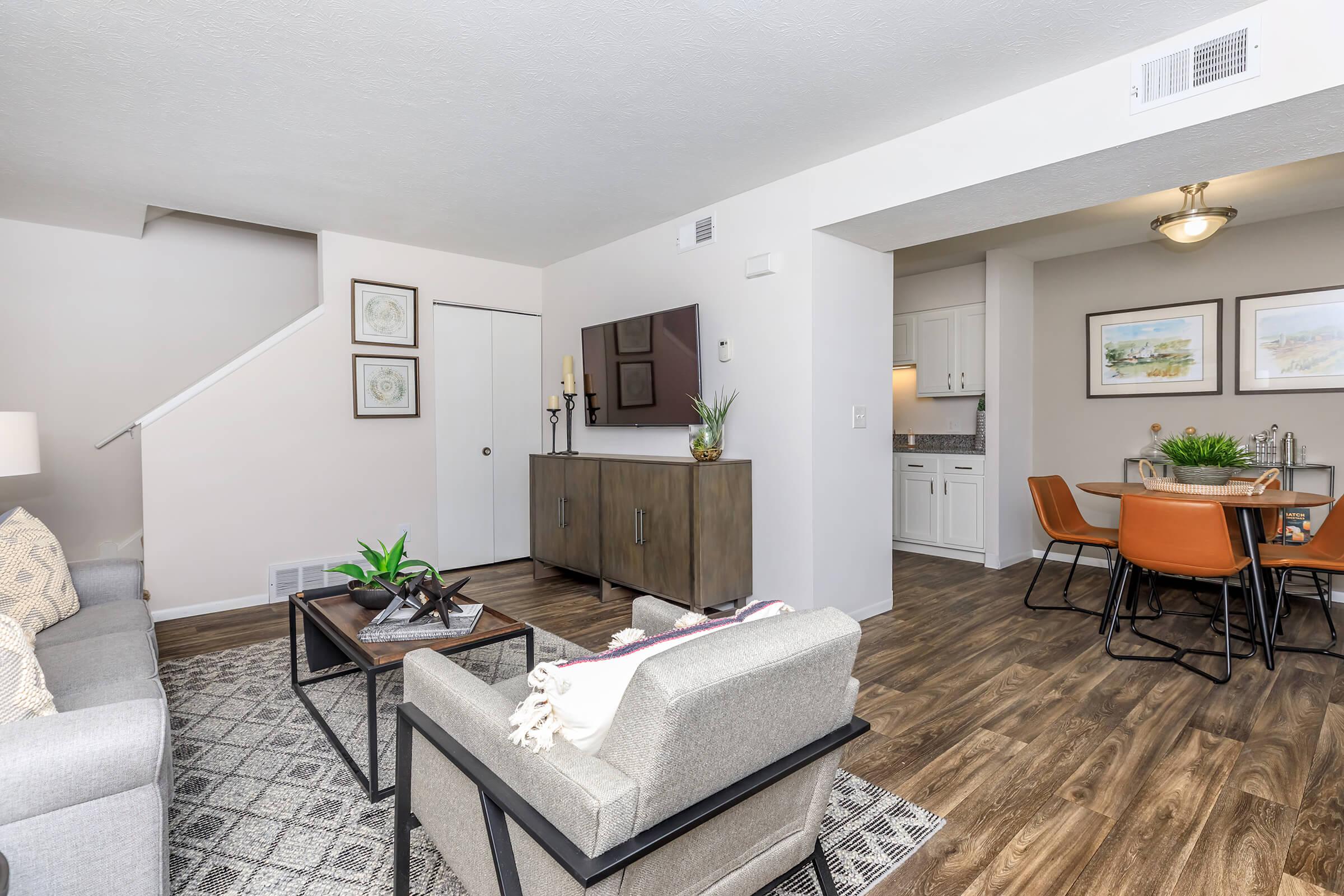 a living room filled with furniture and a table