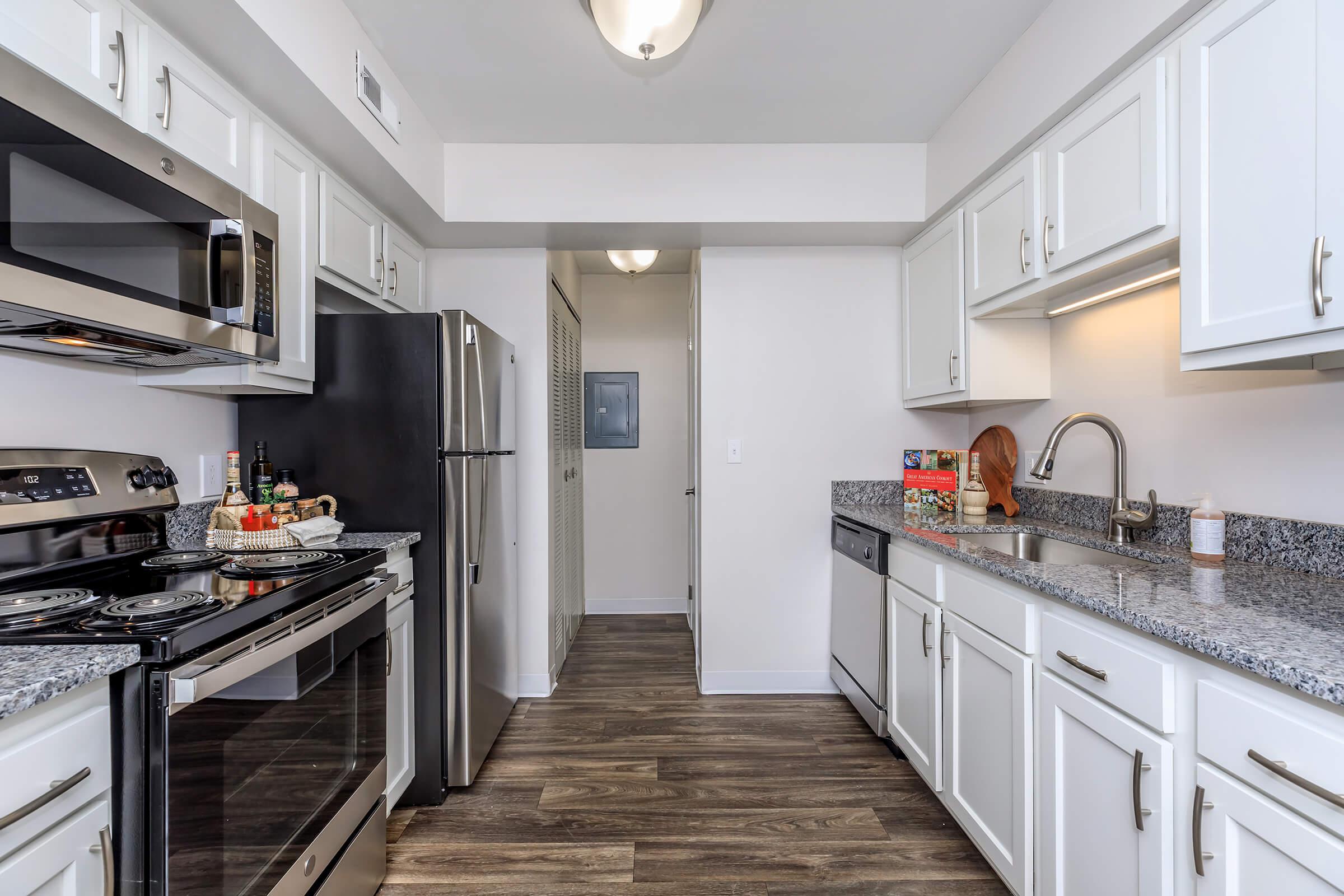 a large kitchen with stainless steel appliances