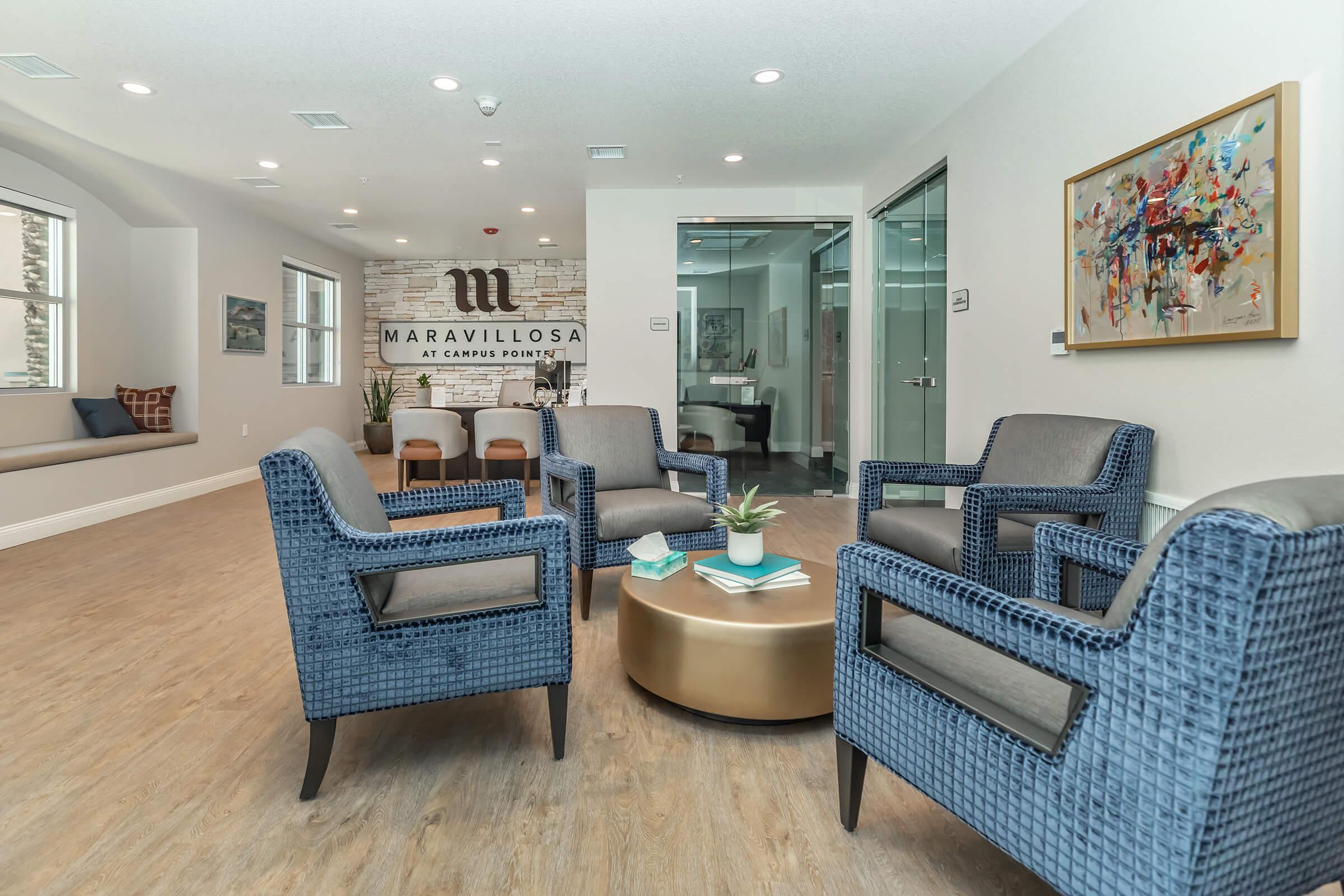 a living room filled with furniture and a large window