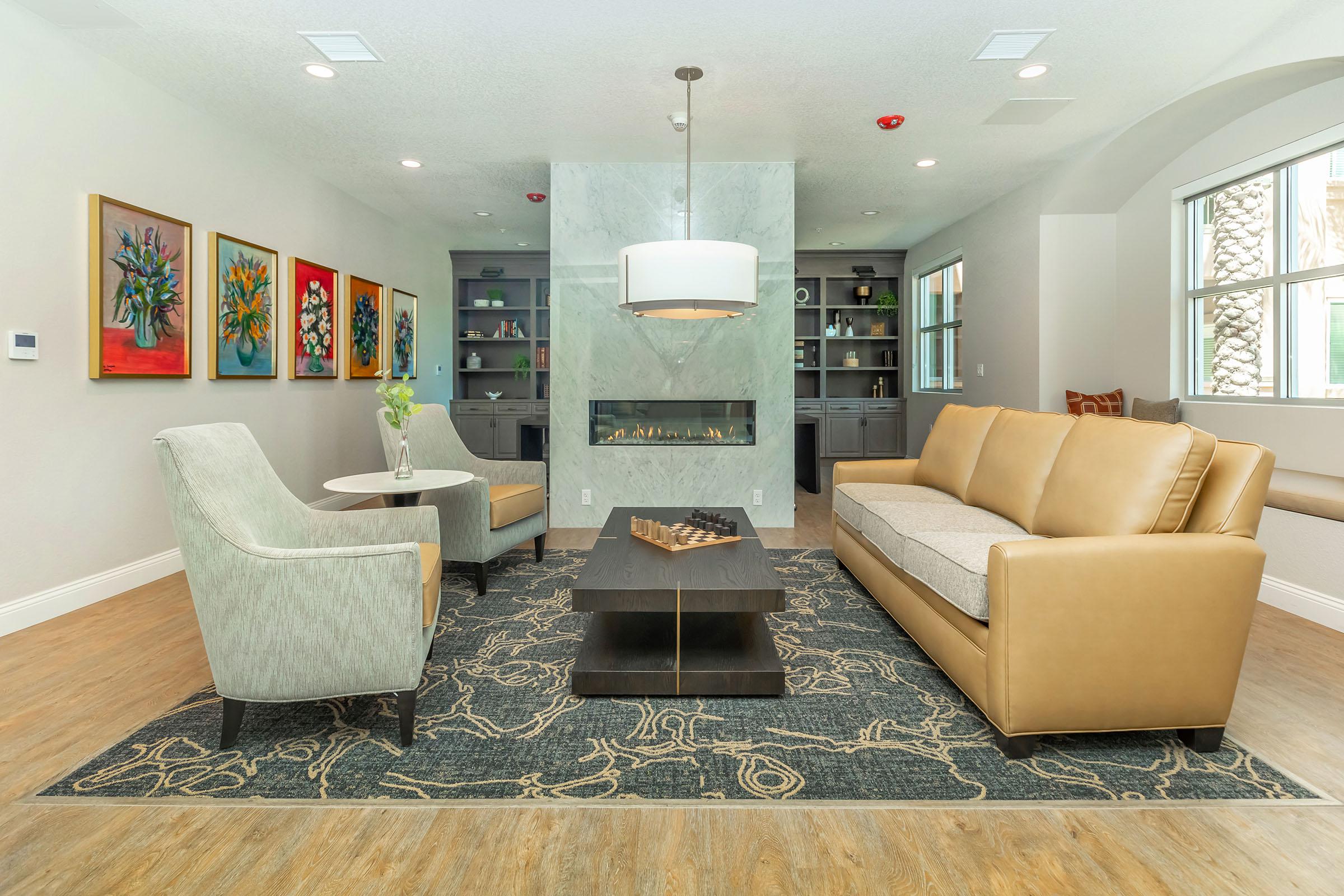 a living room filled with furniture and a tv