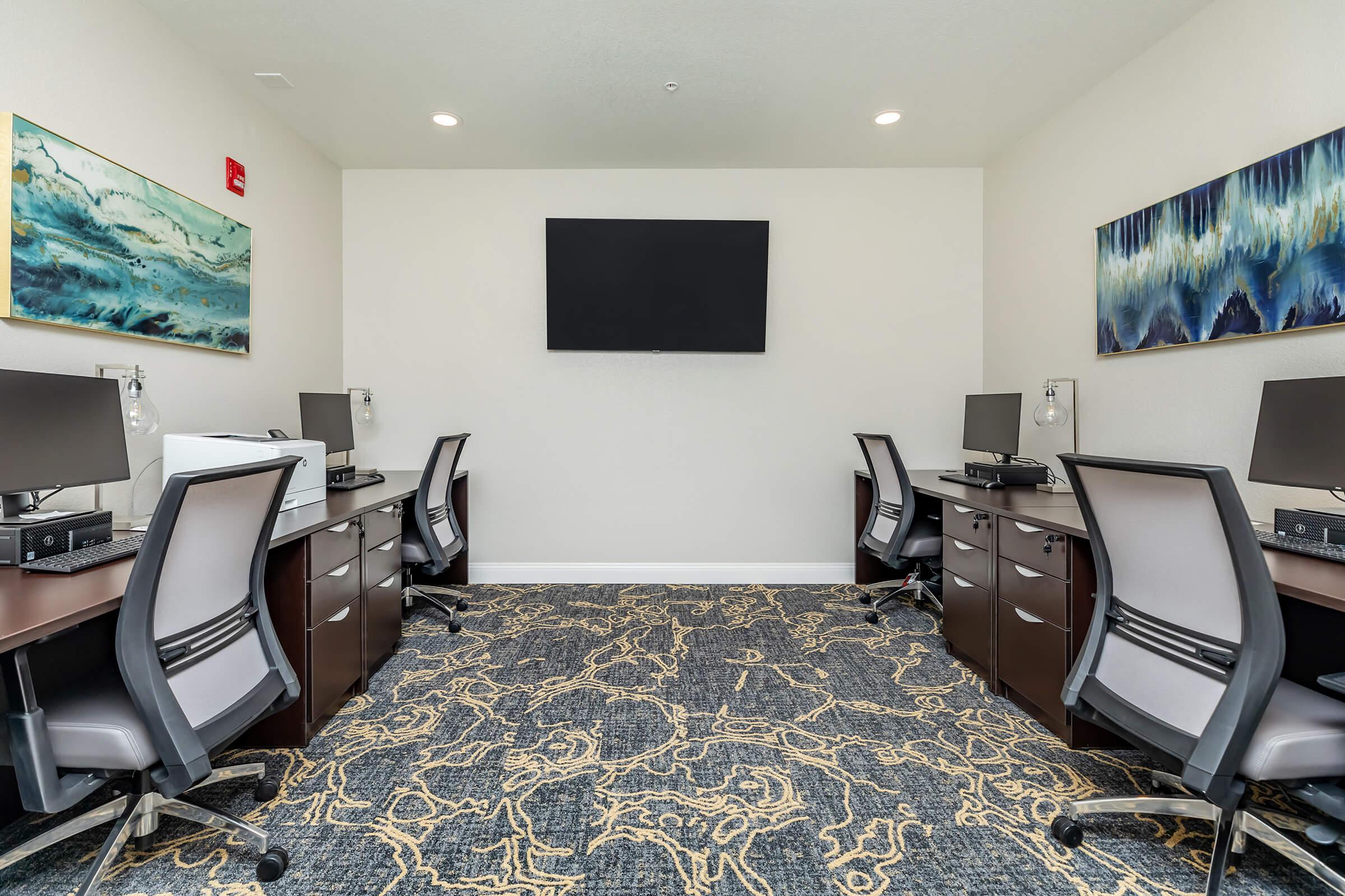 a bedroom with a bed and desk in a room