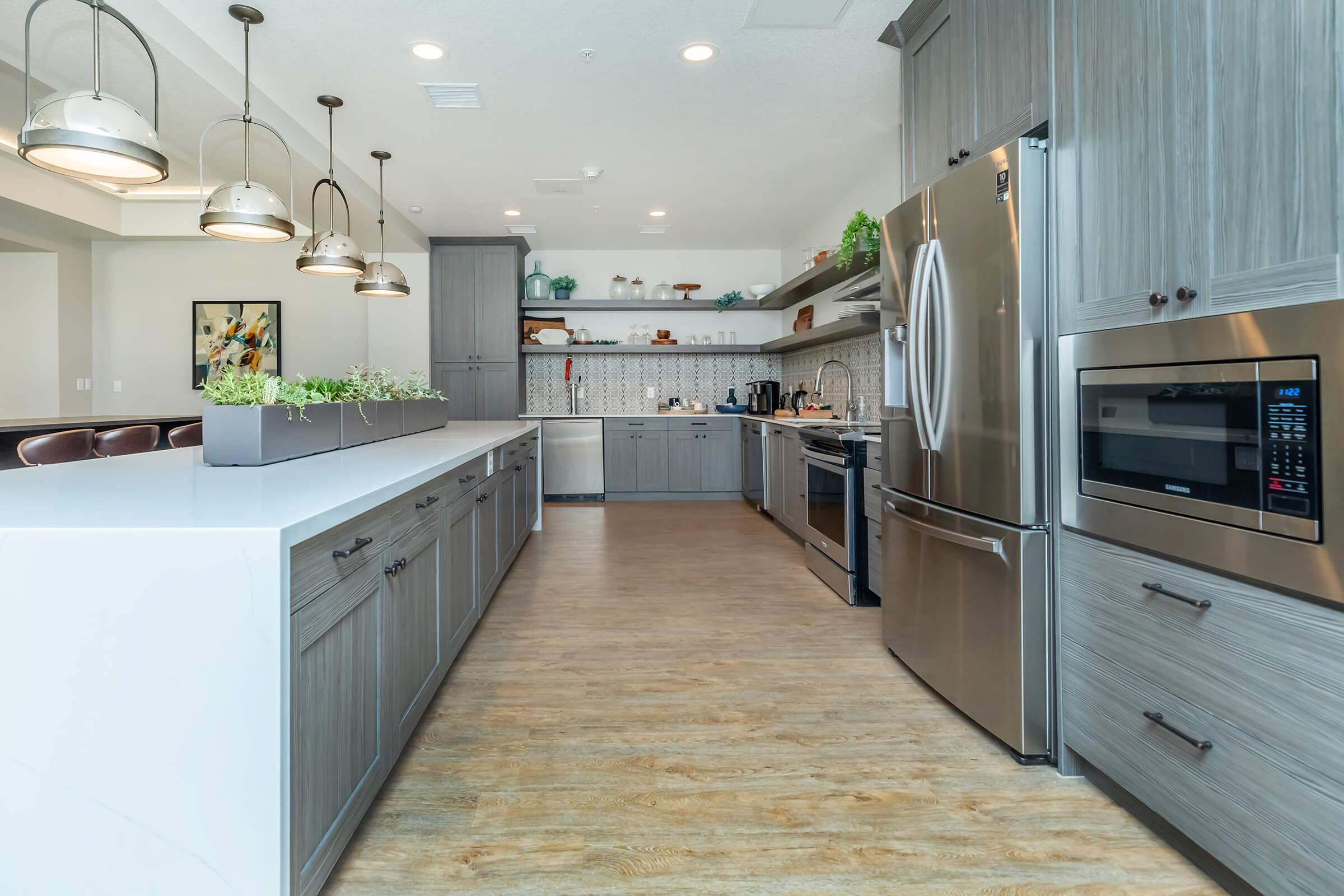 a kitchen area with a building in the background