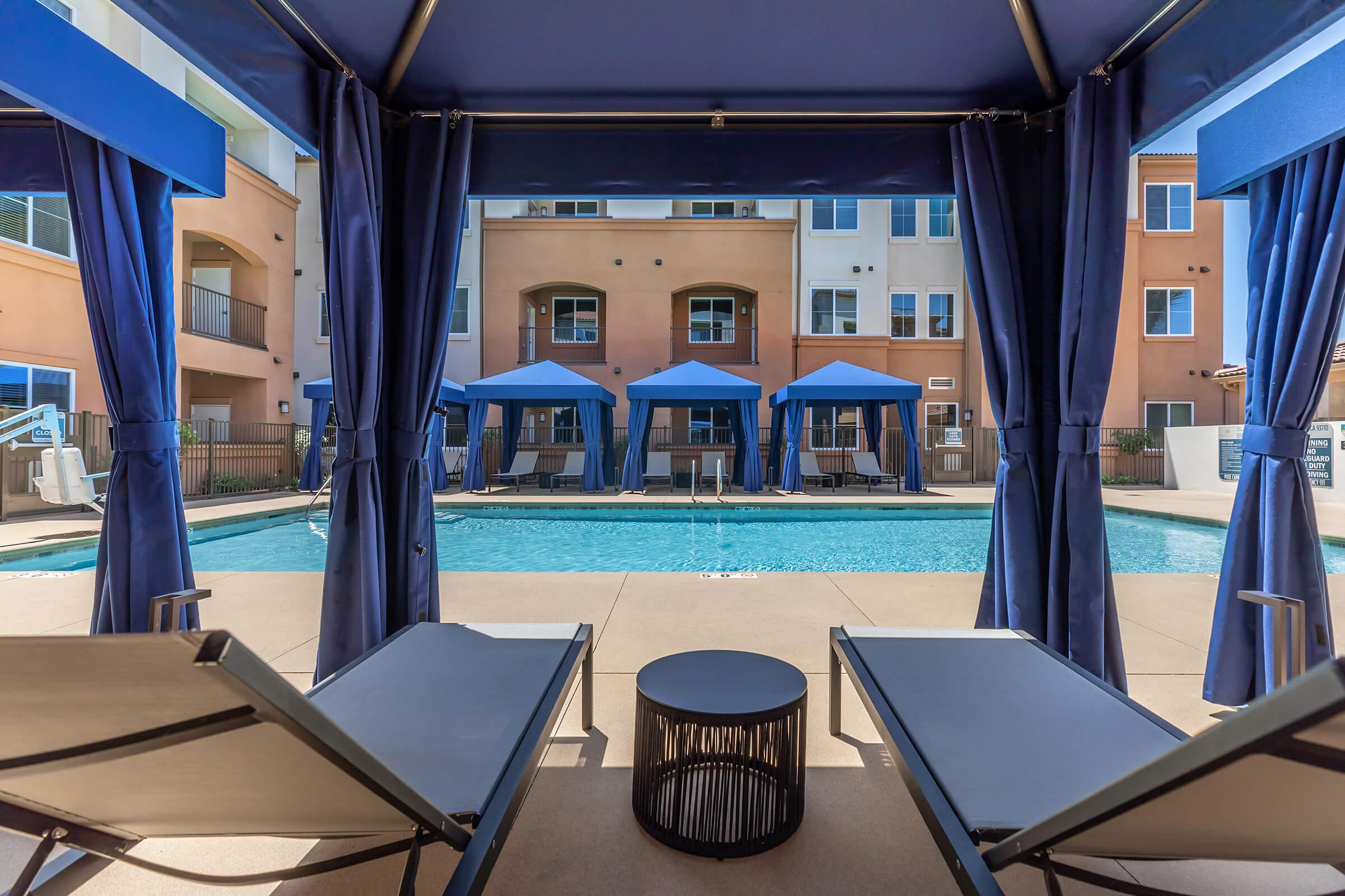 a dining room table with a blue umbrella