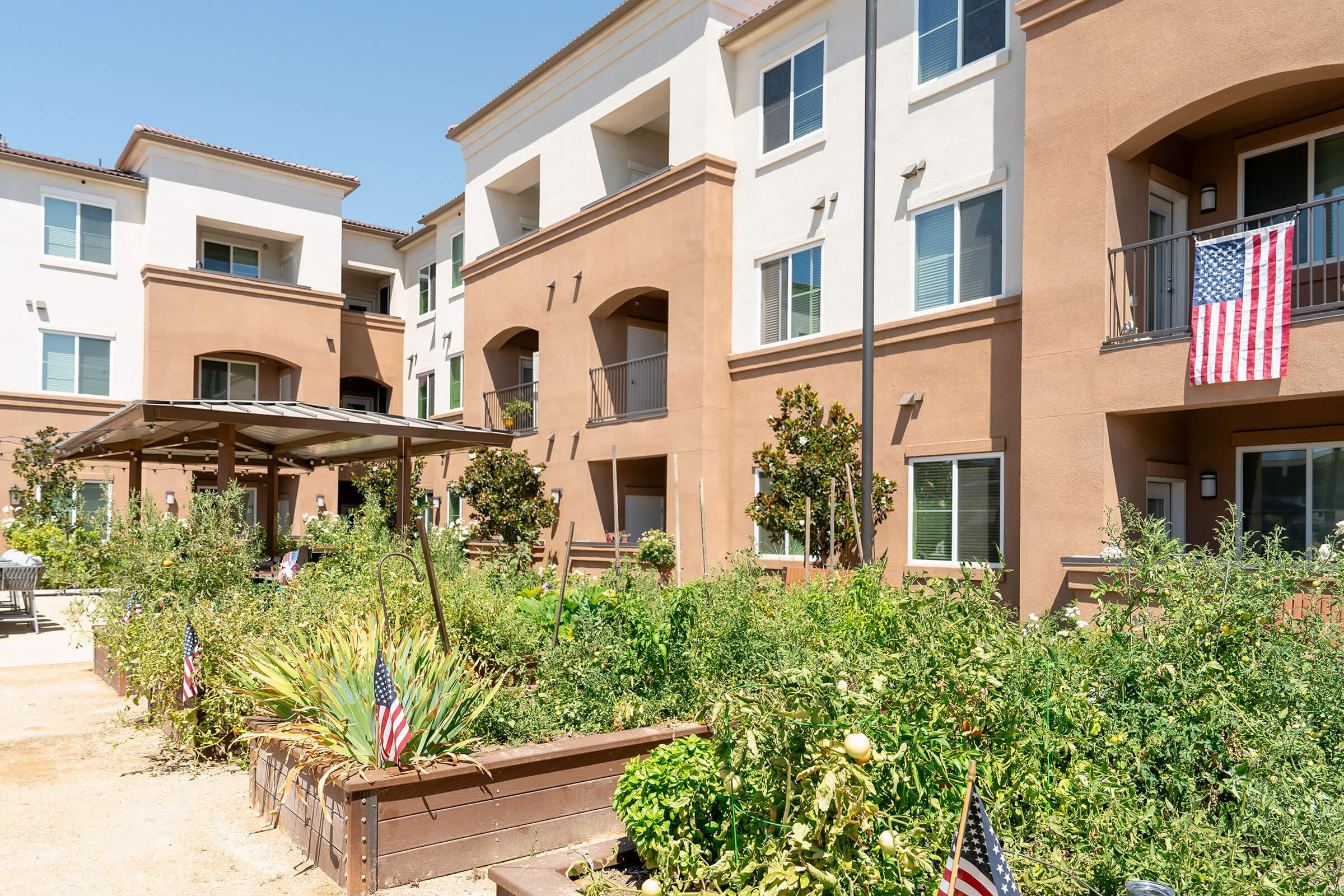 a garden in front of a building