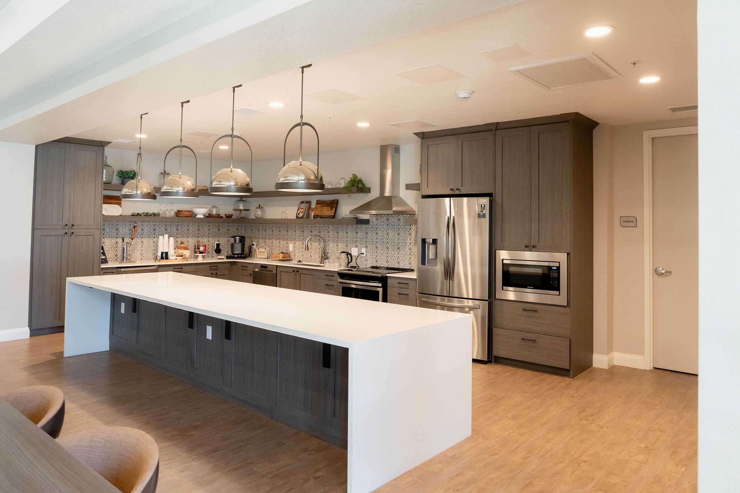 a kitchen with an island in the middle of a room