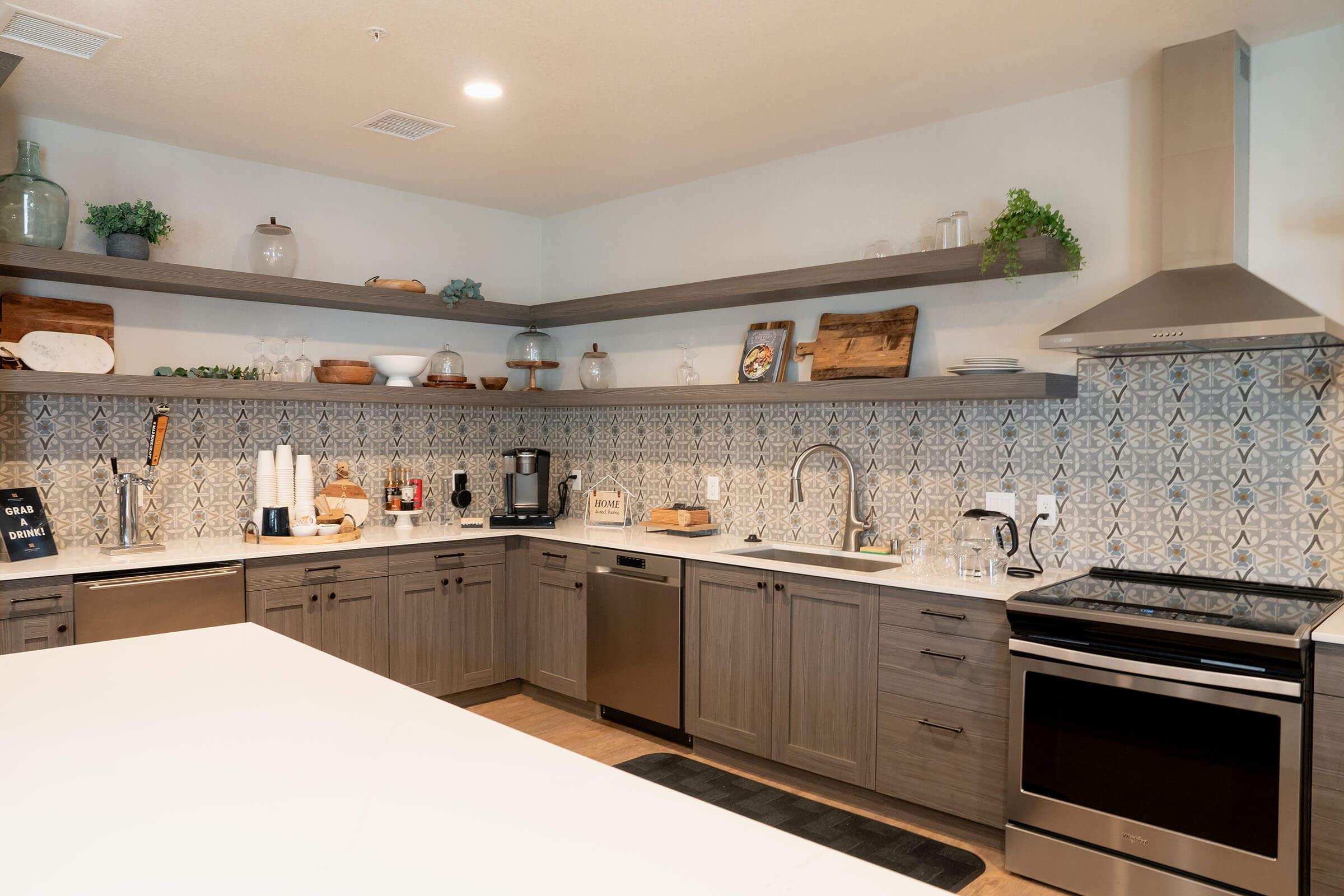 a kitchen with a stove and a sink