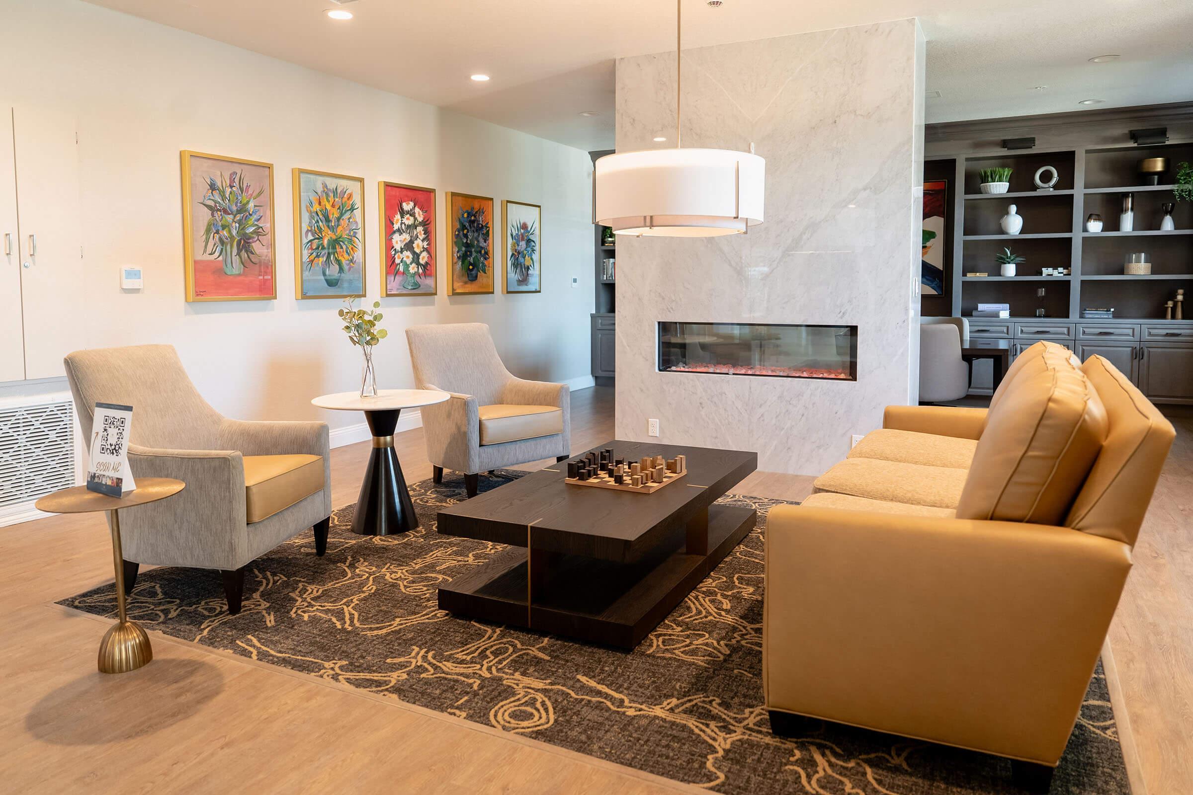 a living room filled with furniture and a fireplace