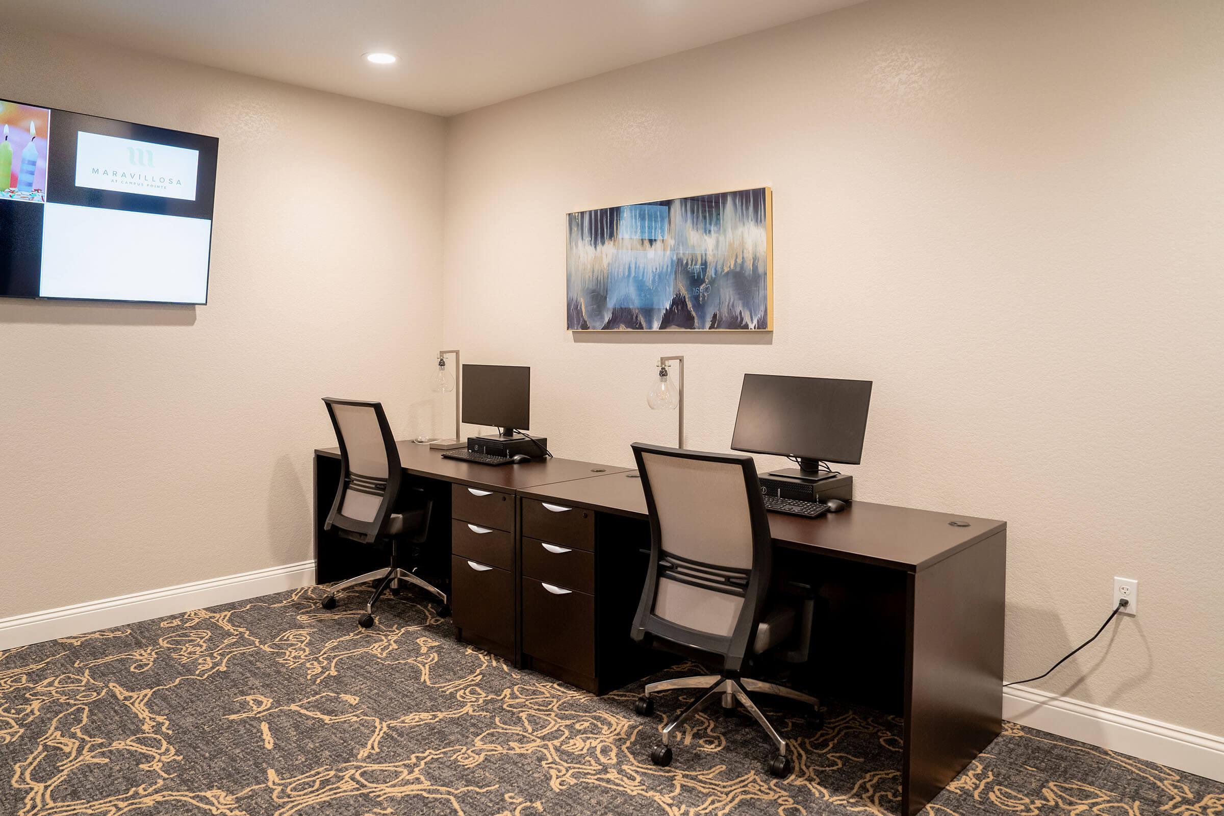 a bedroom with a bed and desk in a room