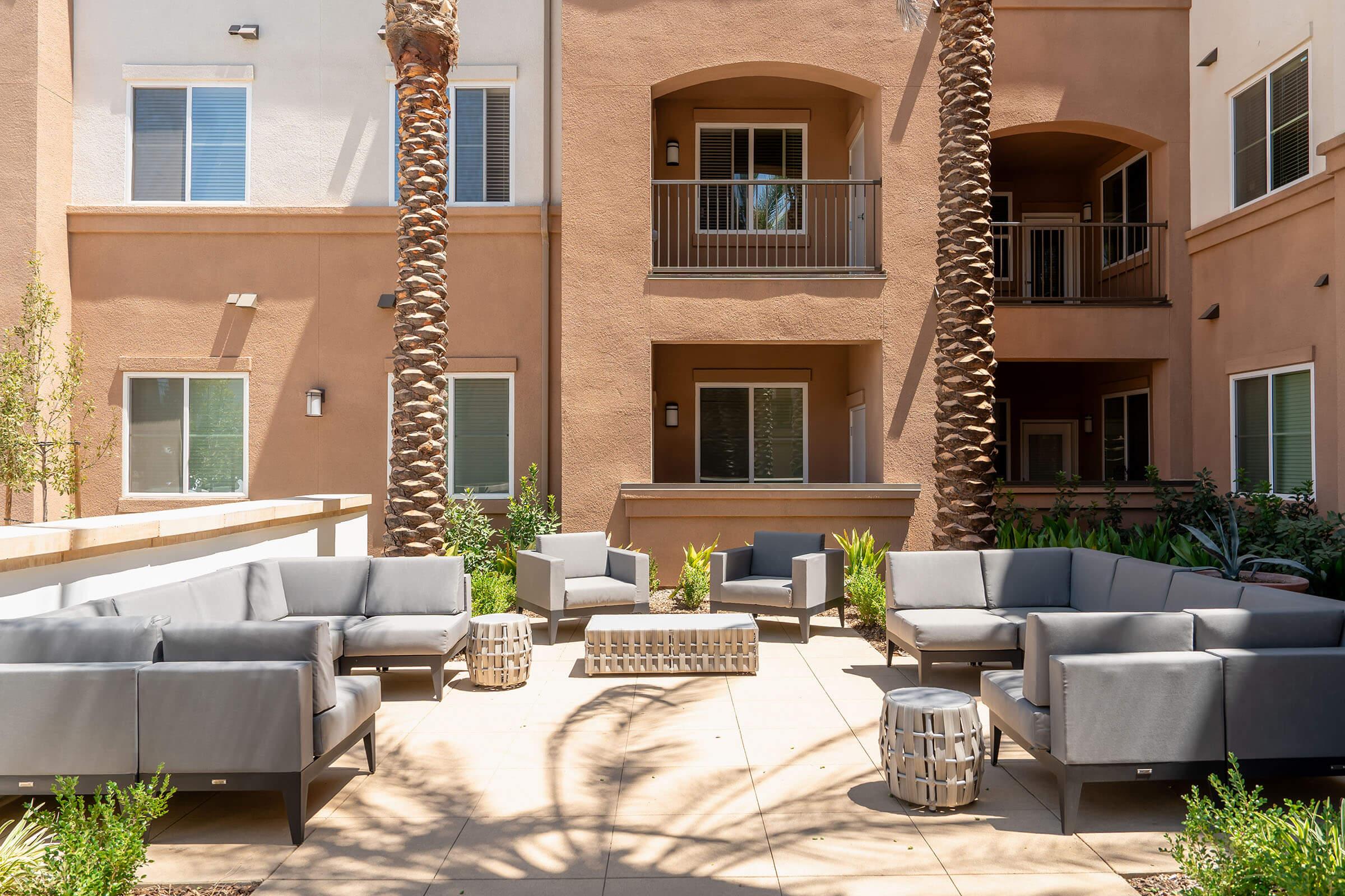 a living area with a building in the background