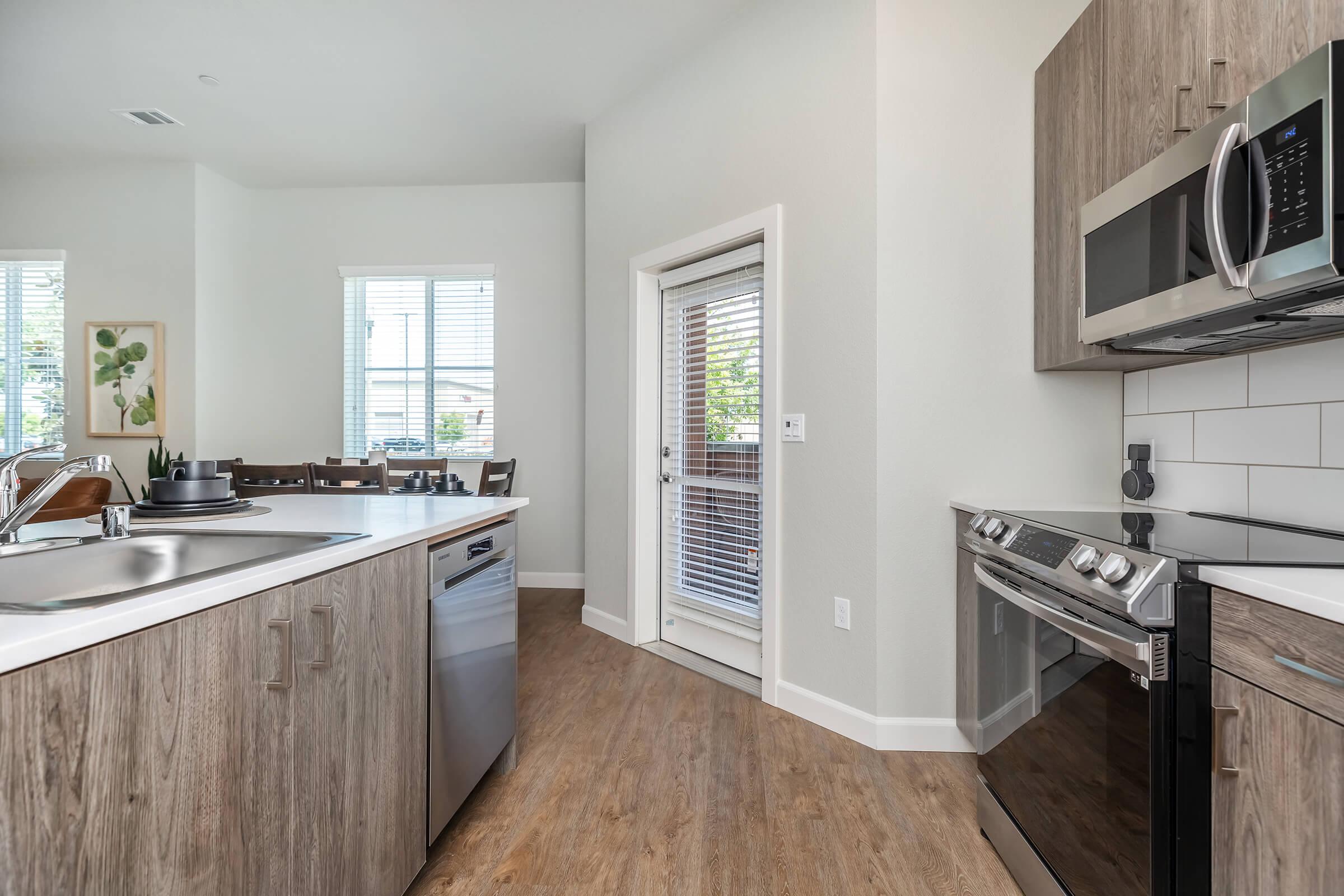 a kitchen with a sink and a window