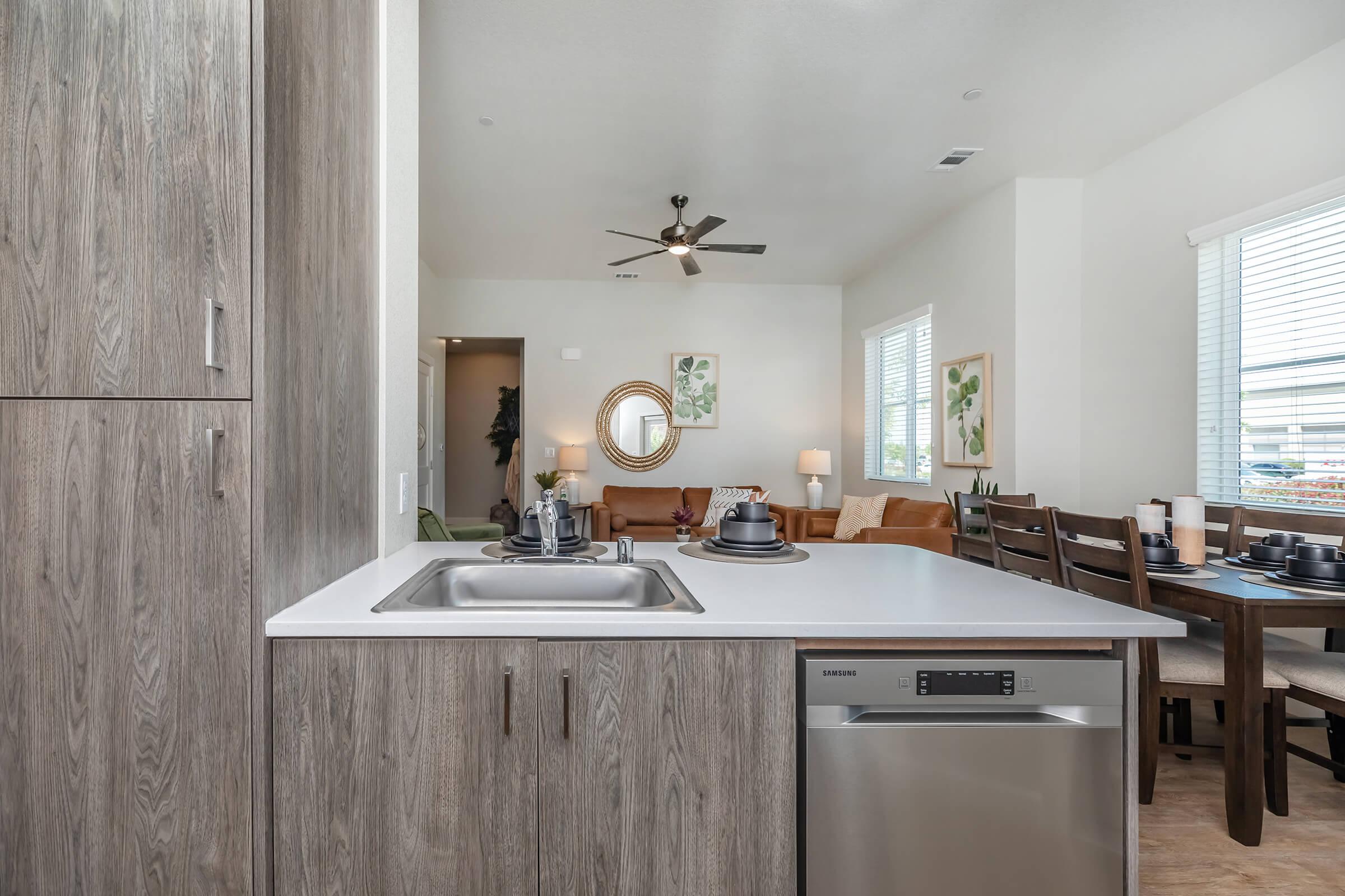 a kitchen with wooden cabinets and a sink