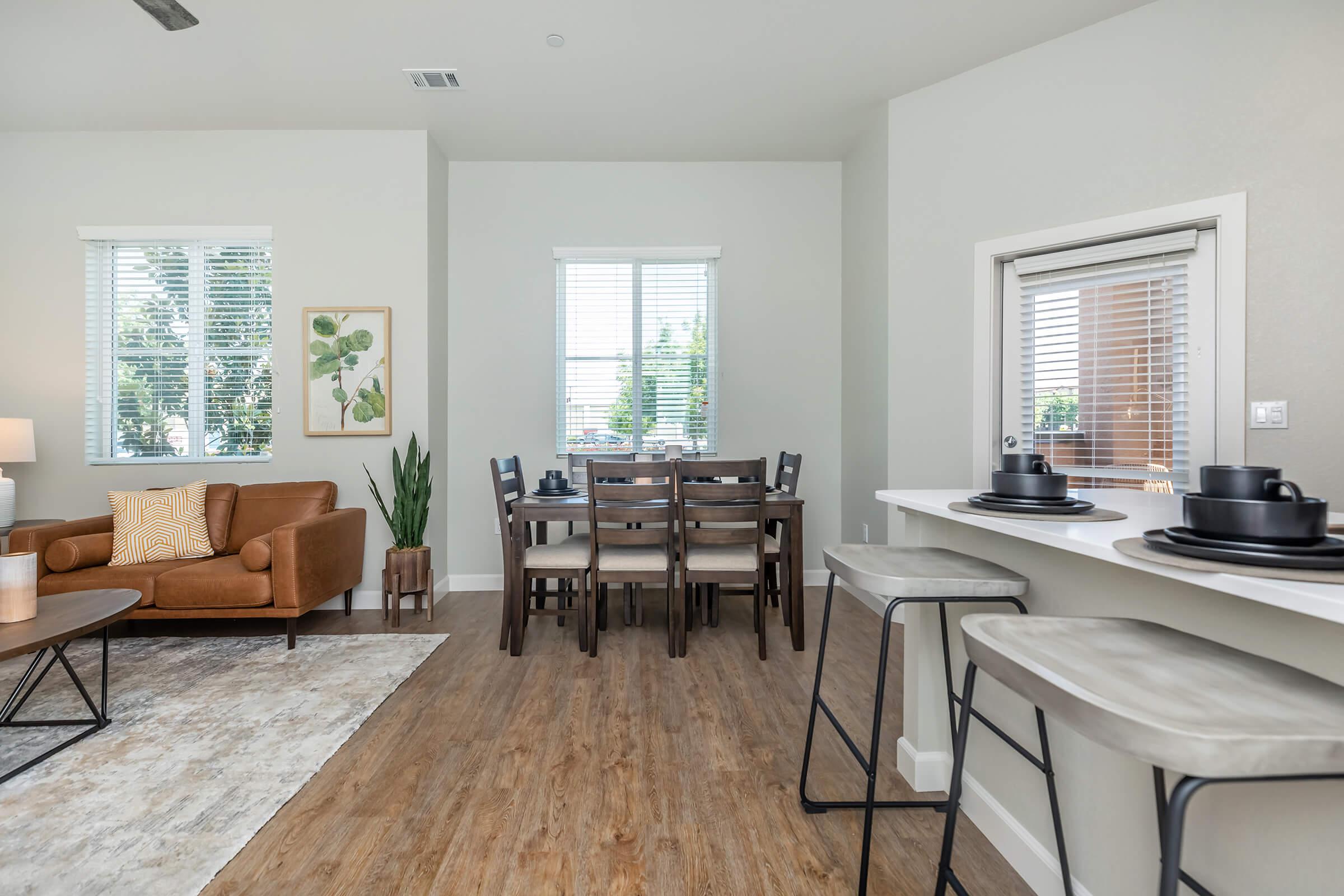 a living room filled with furniture and a large window