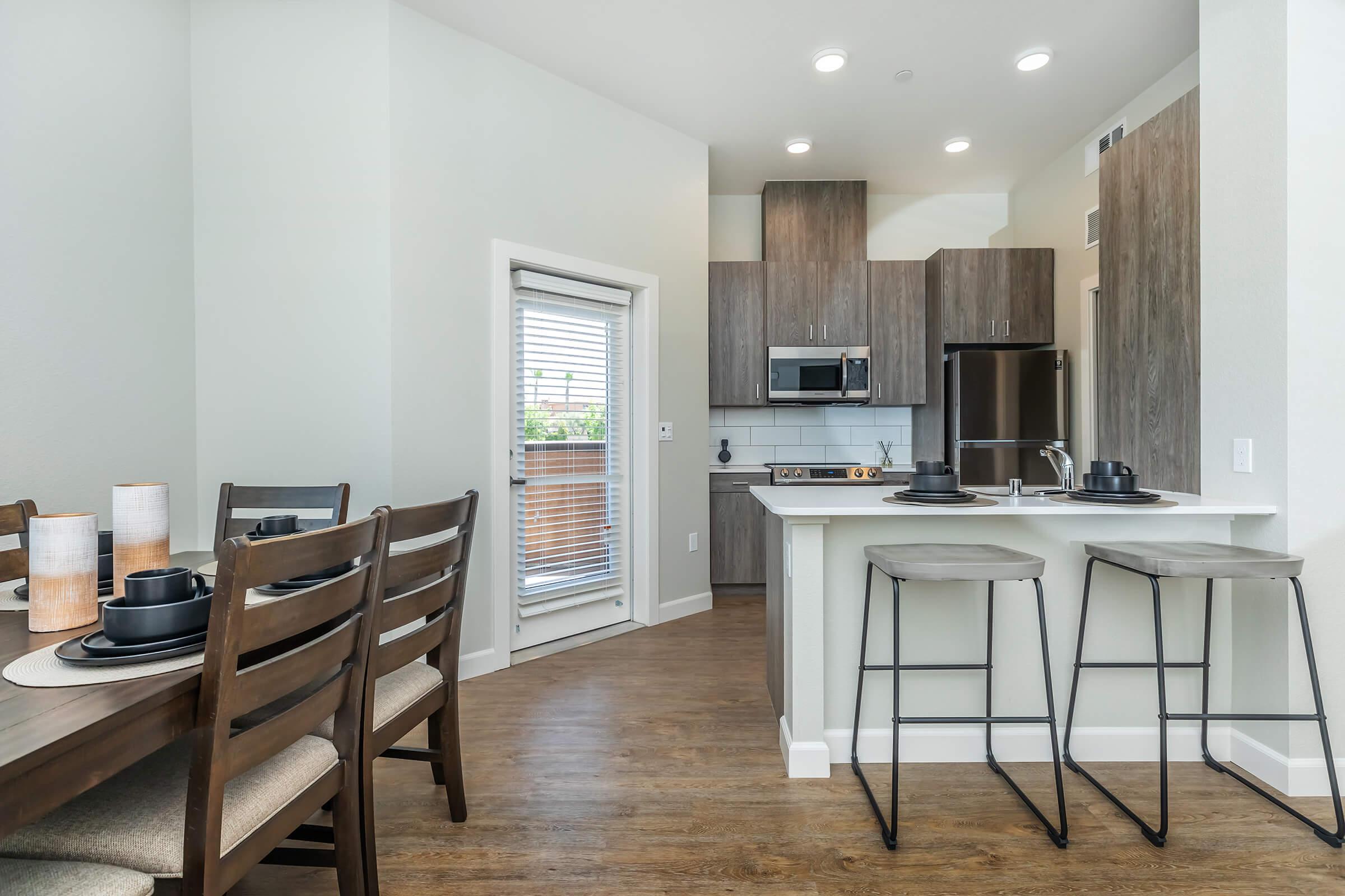 a kitchen with a dining room table