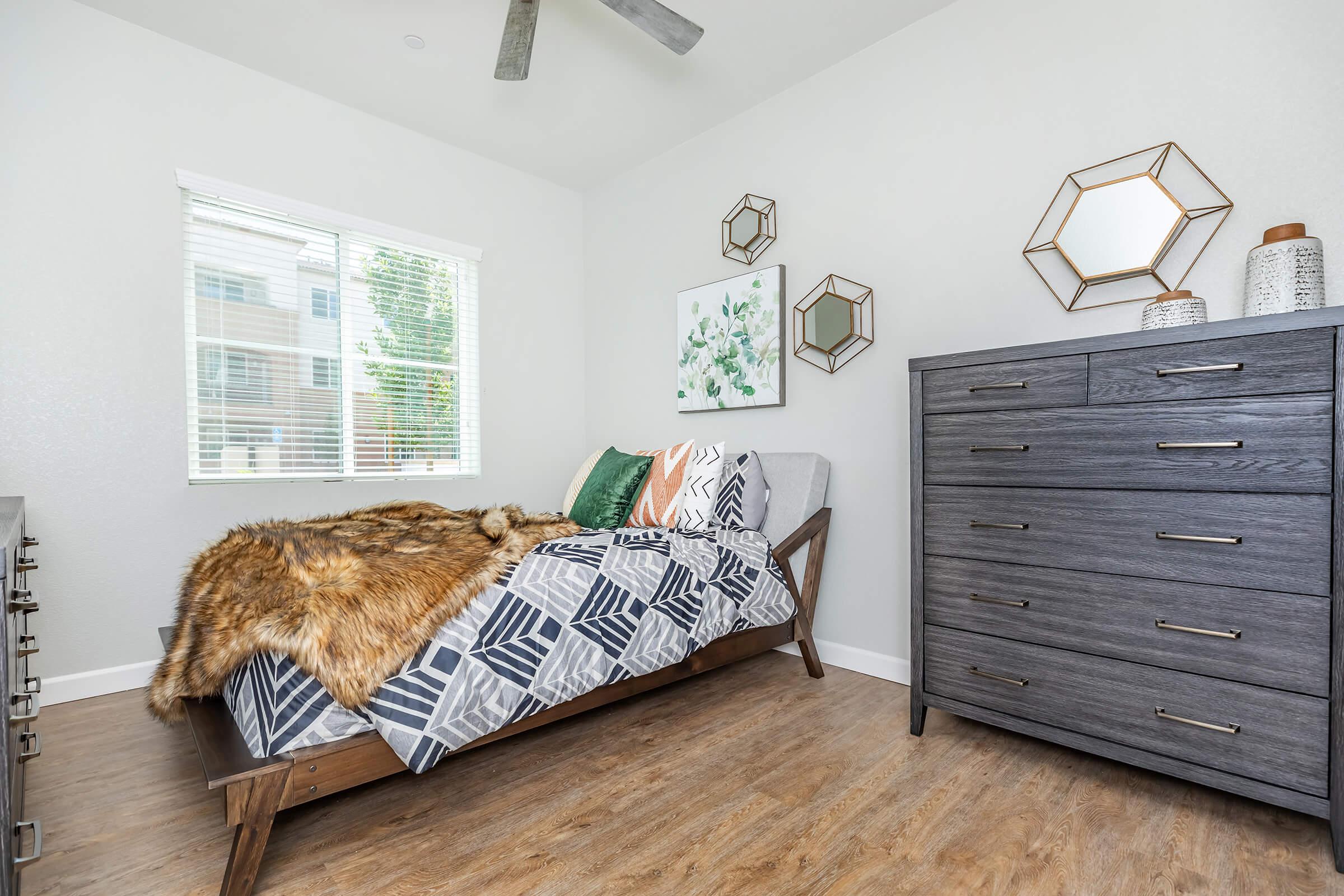 a bedroom with a cat in a room