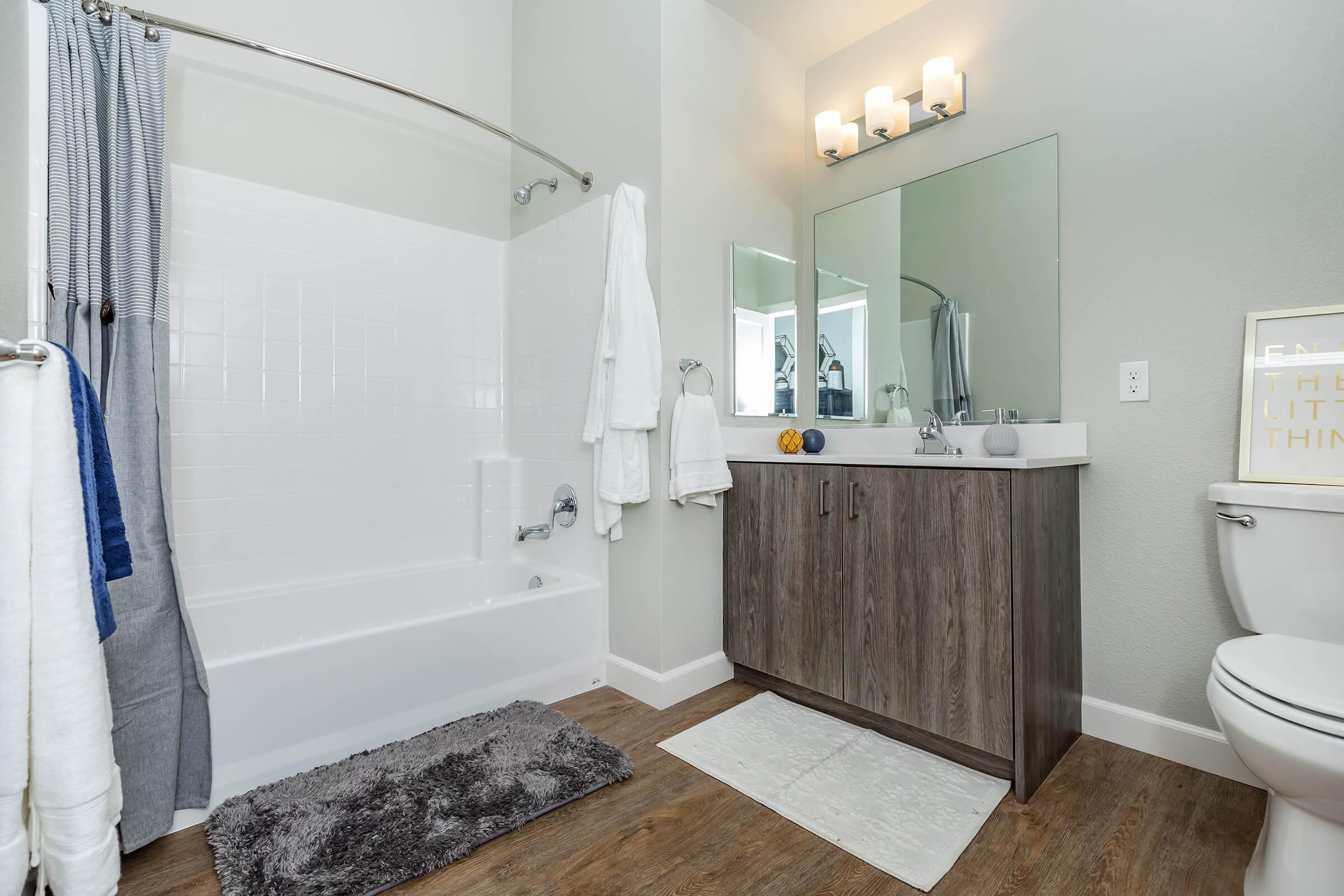 a room with a sink and a shower