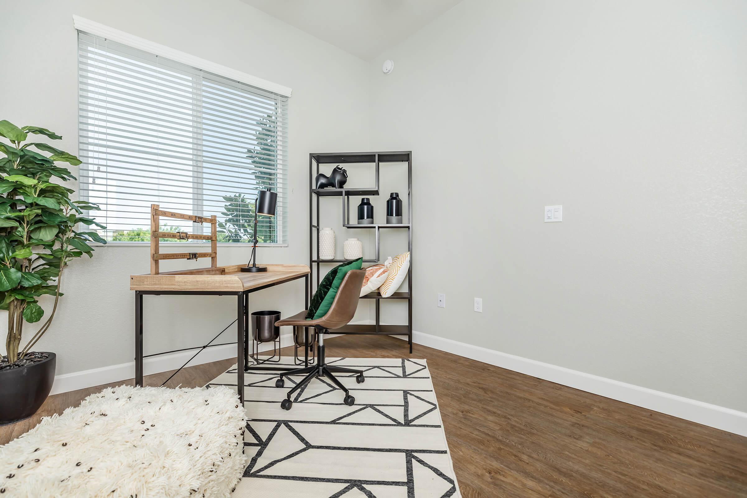 a room filled with furniture and a large window