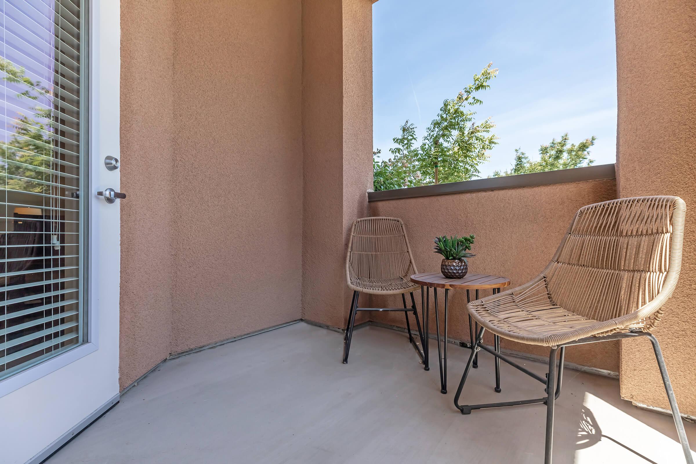 a chair sitting in front of a building