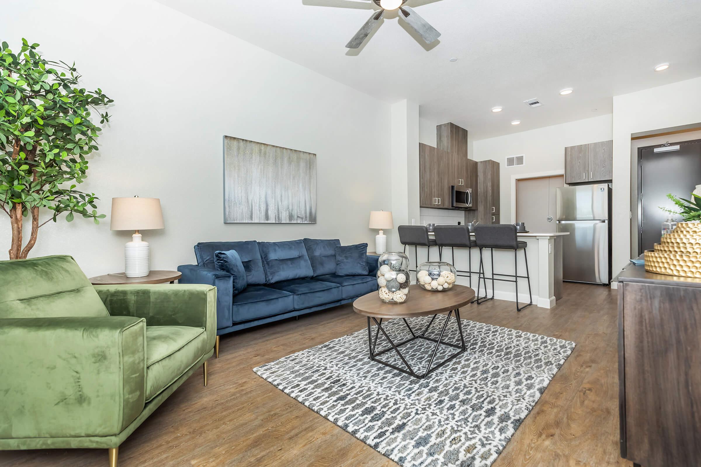 a living room filled with furniture and a rug