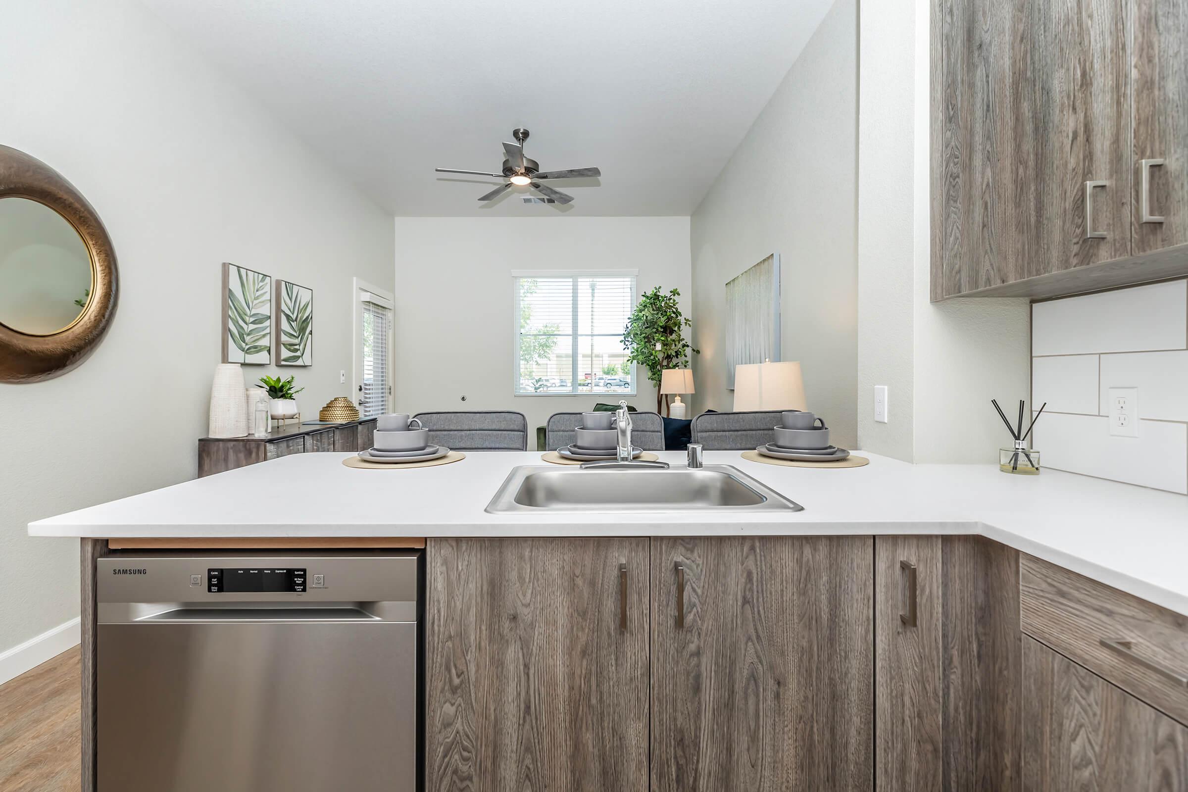 a kitchen with a sink and a microwave