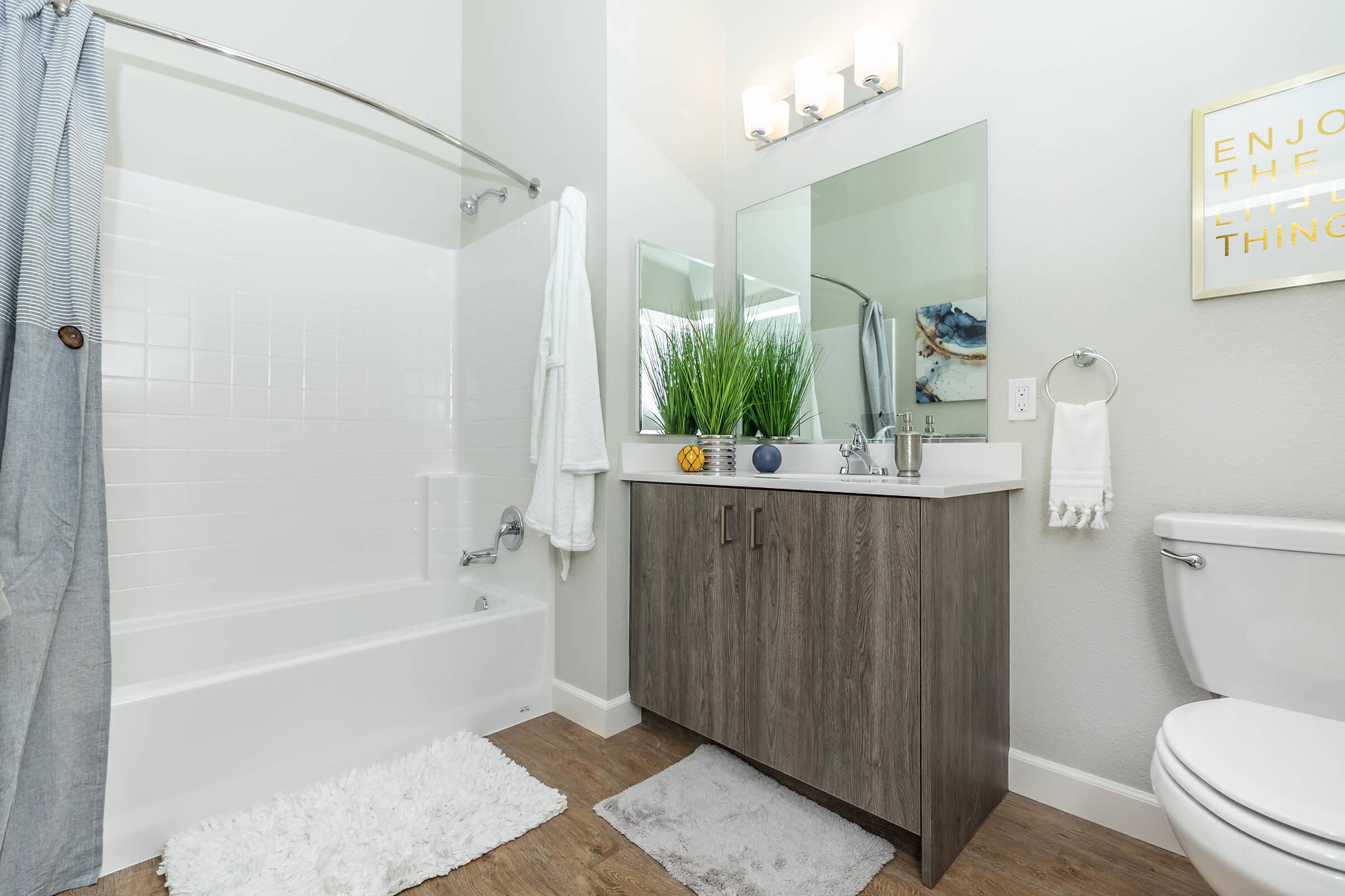 a room with a sink and a shower