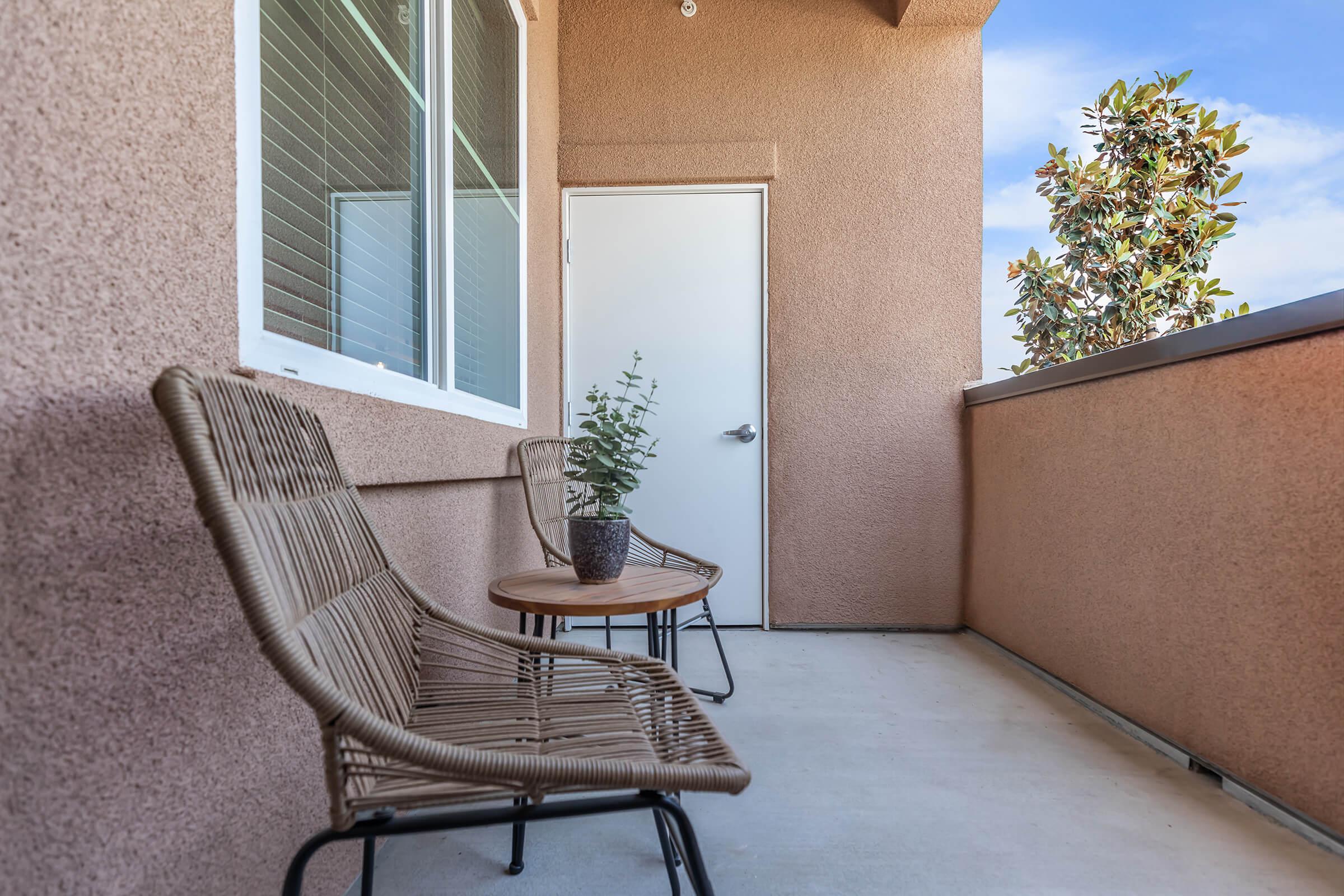 a chair sitting in front of a brick building