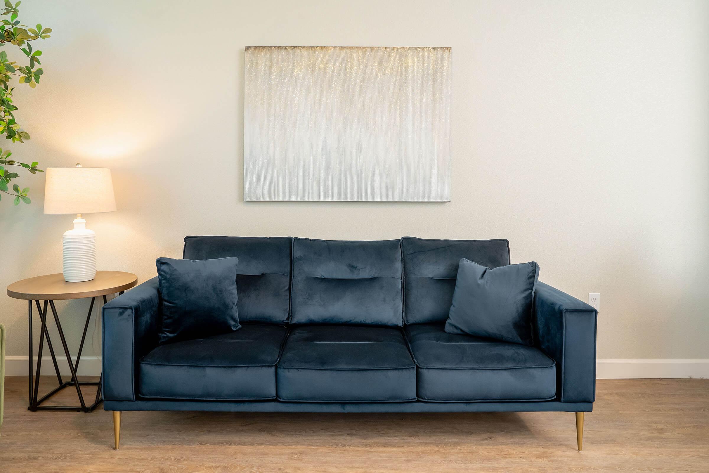 a brown leather couch in a living room