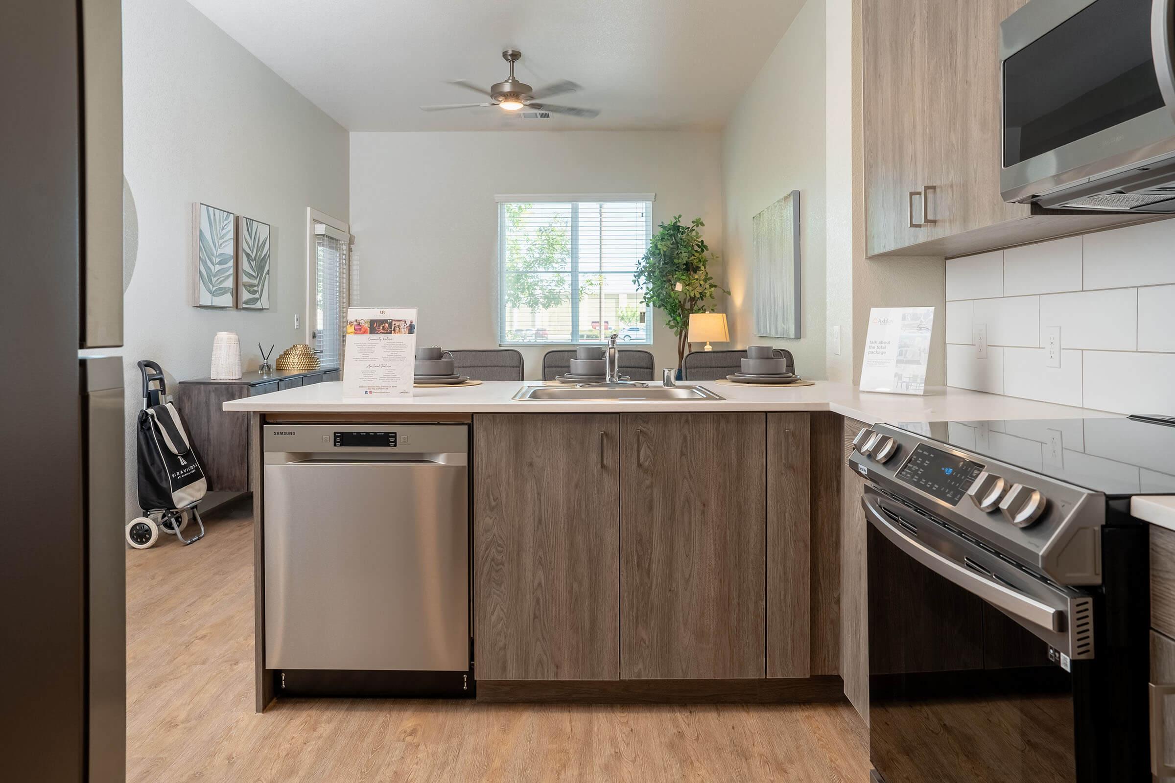 a stove top oven sitting inside of a kitchen