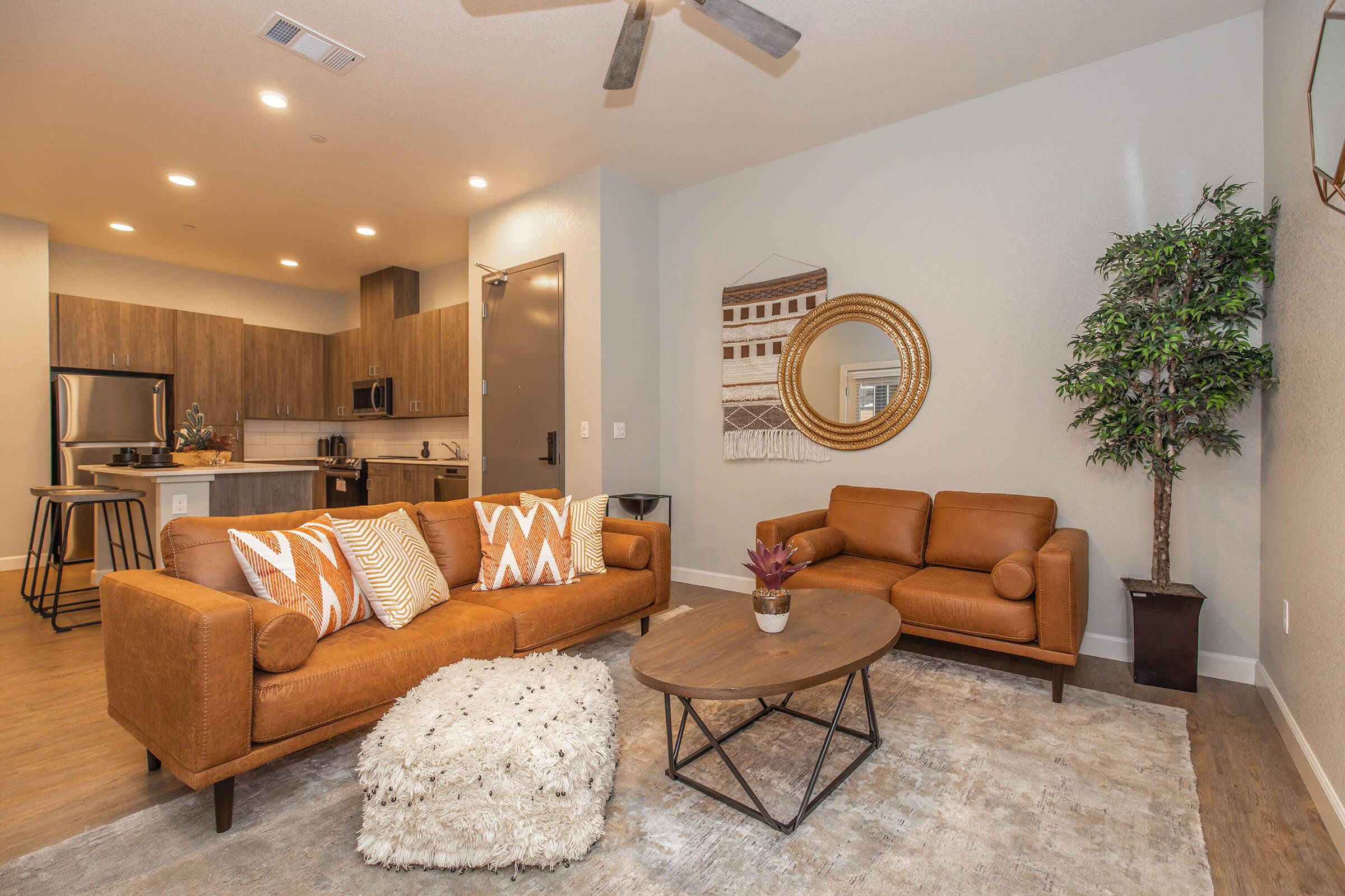 a living room filled with furniture and a flat screen tv