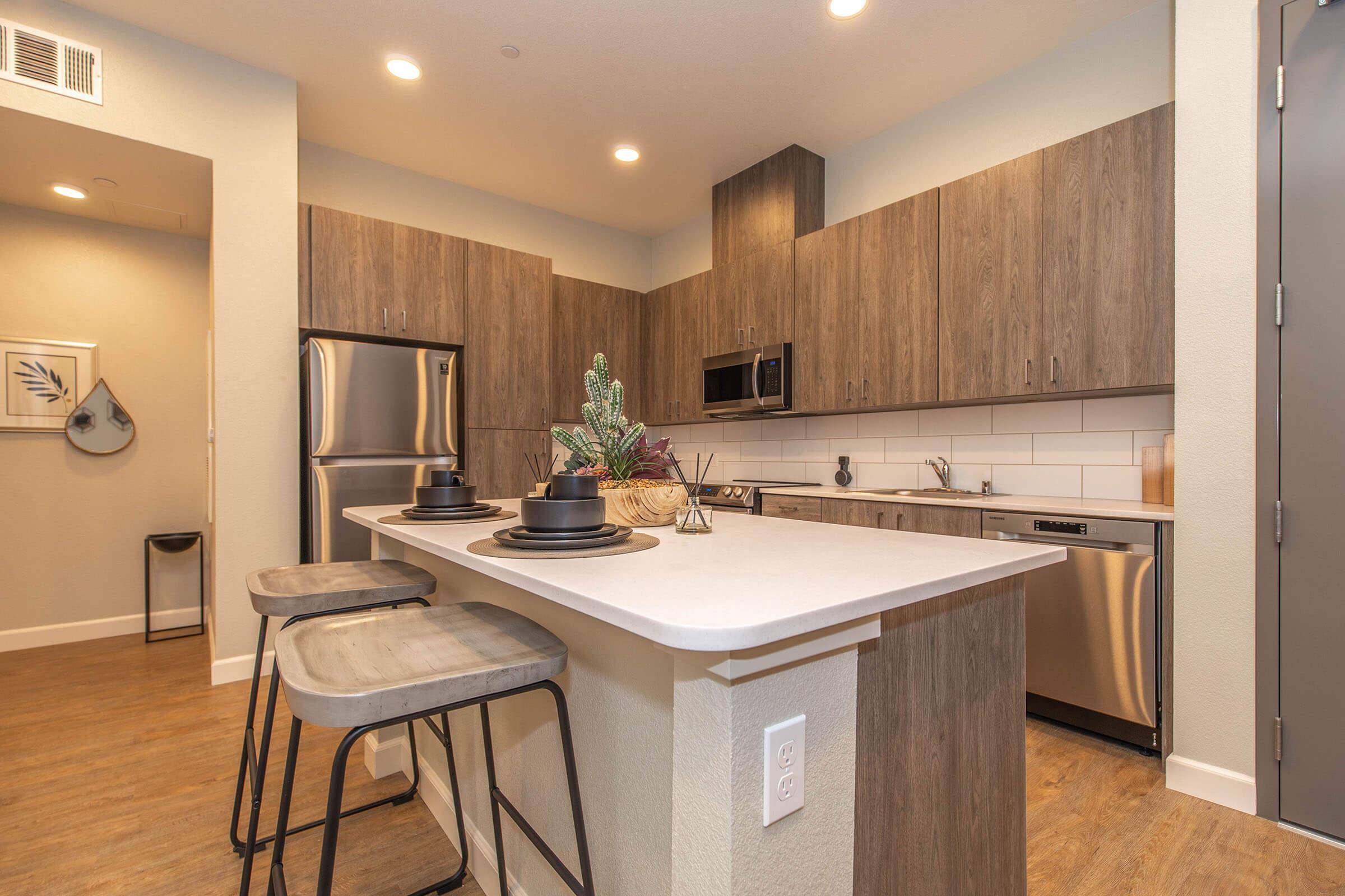 a kitchen with a sink and a refrigerator