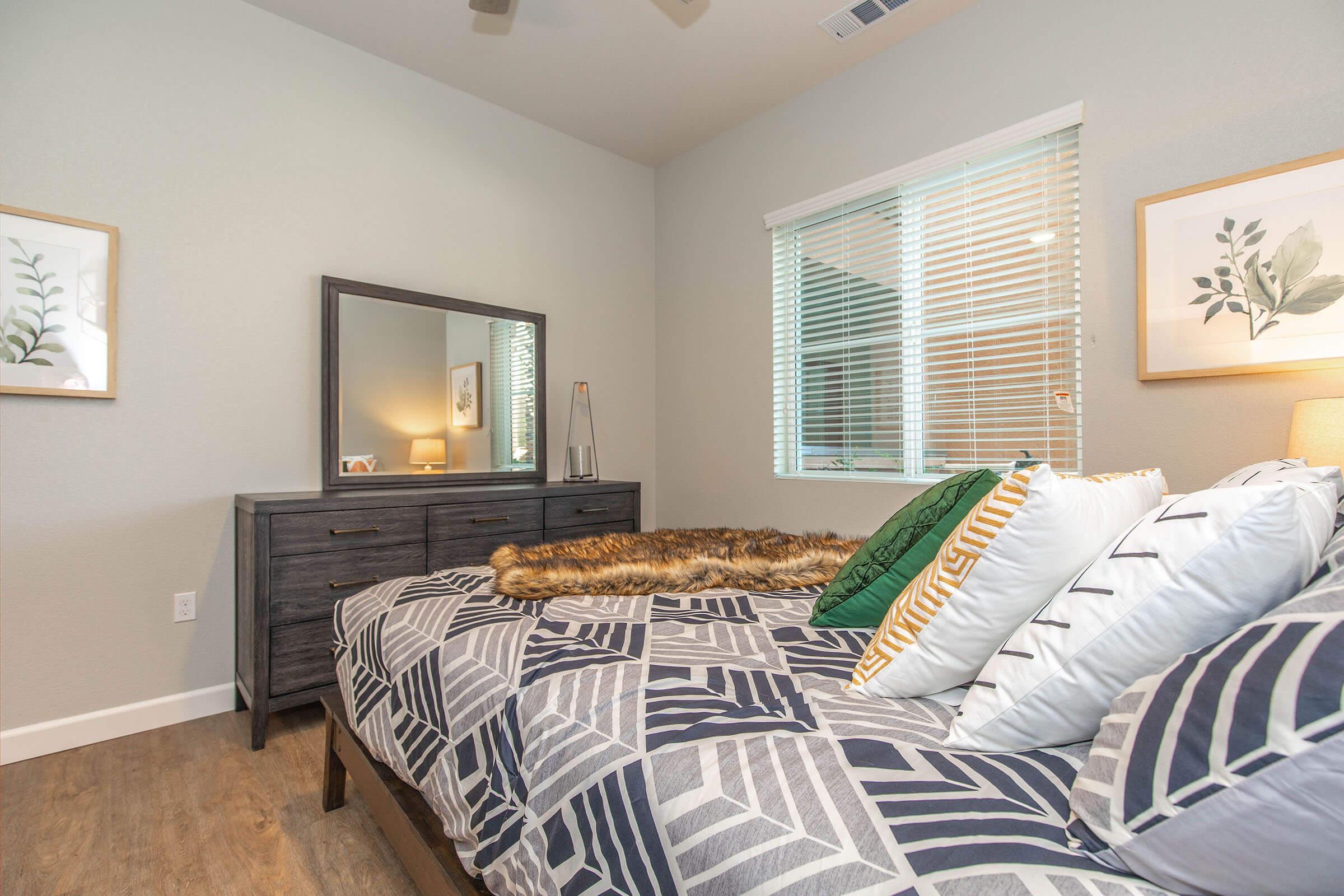 a bedroom with a large bed in a room